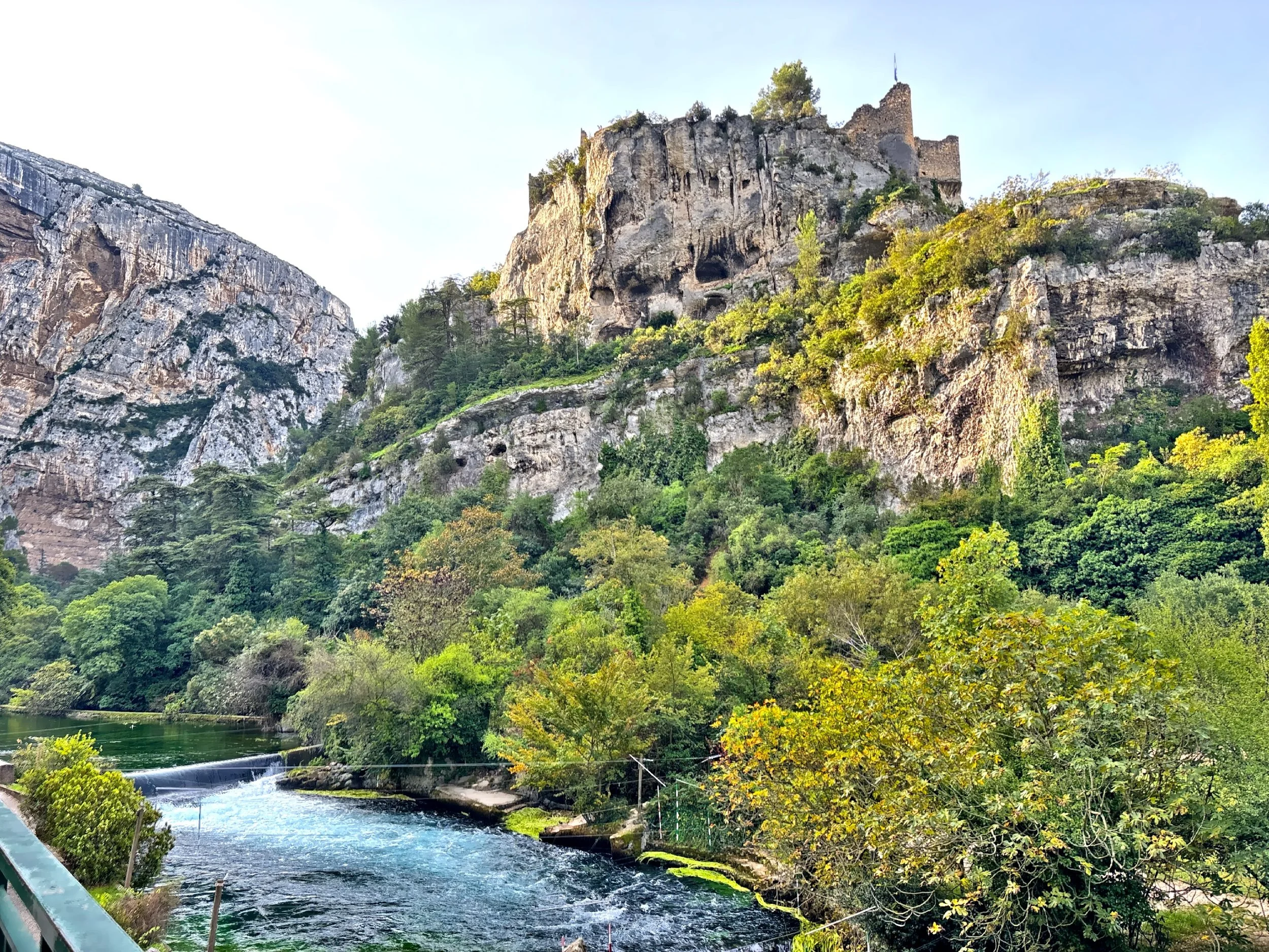  The medieval castle high on the mountain overlooking the river. 