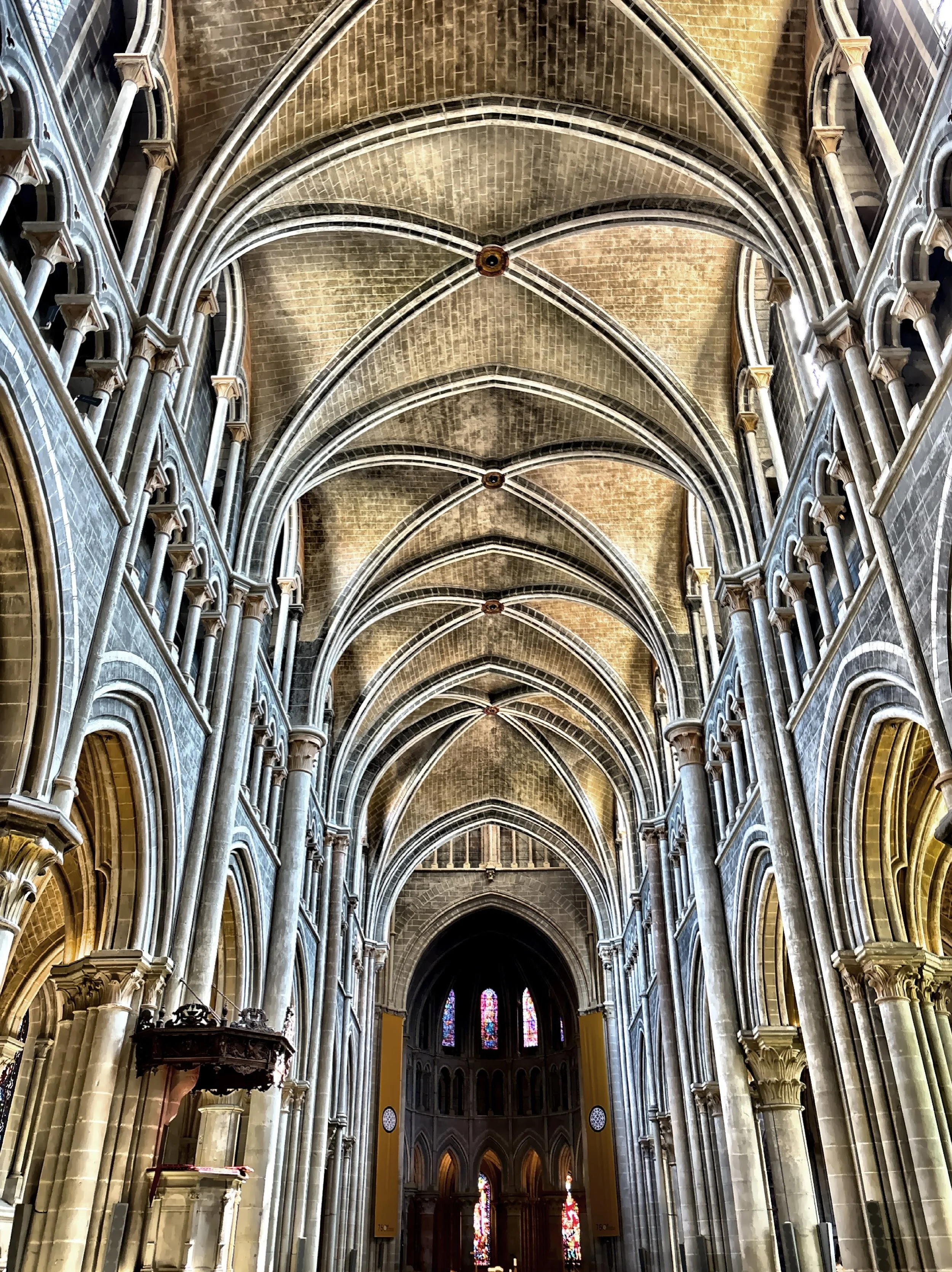  Soaring stone arches and ribbed vaults draw your eyes upward, emphasizing the Gothic sense of height and light. 