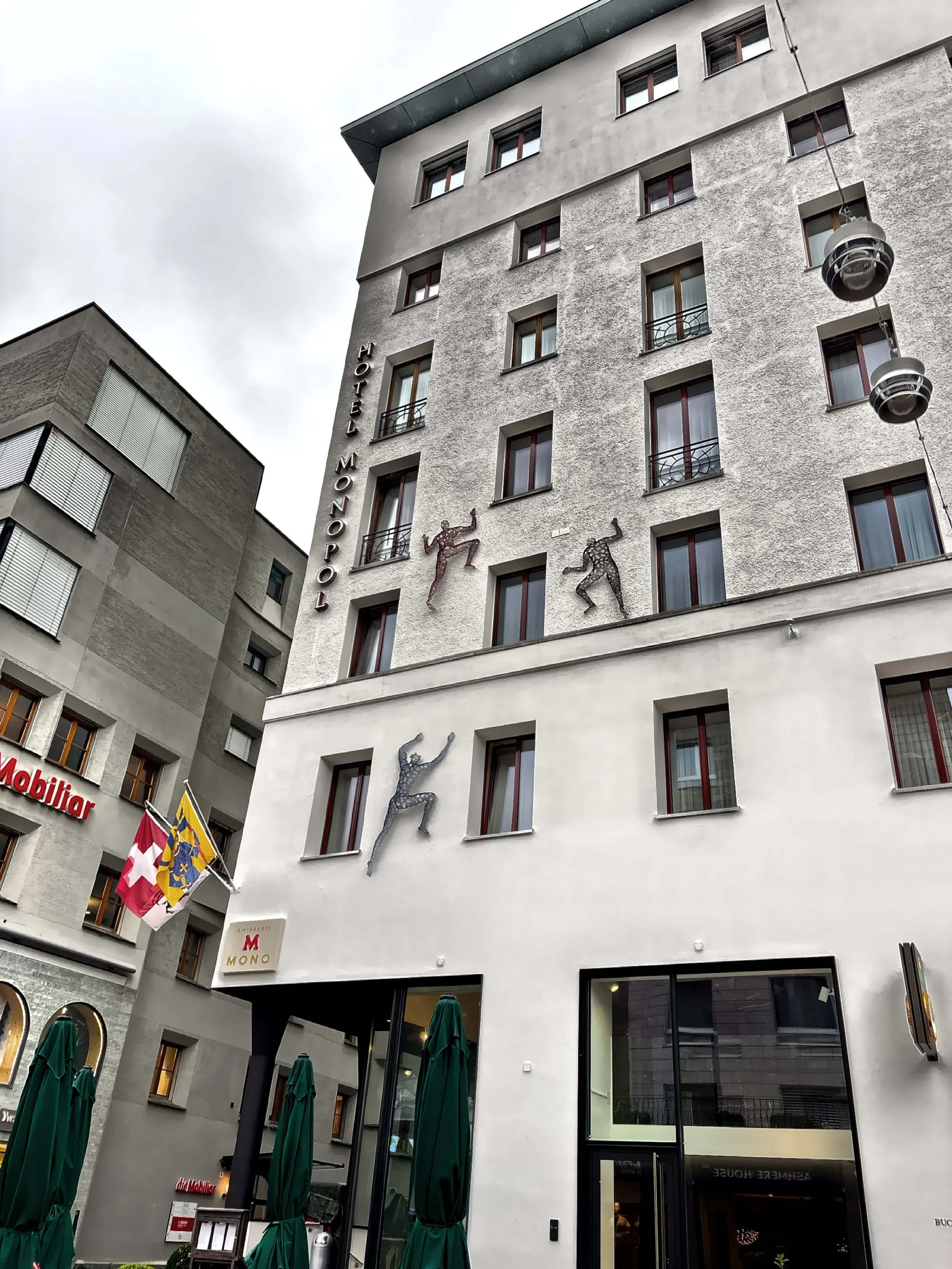  The Art Boutique Hotel Monopol with art installation of humans climbing the facade. 