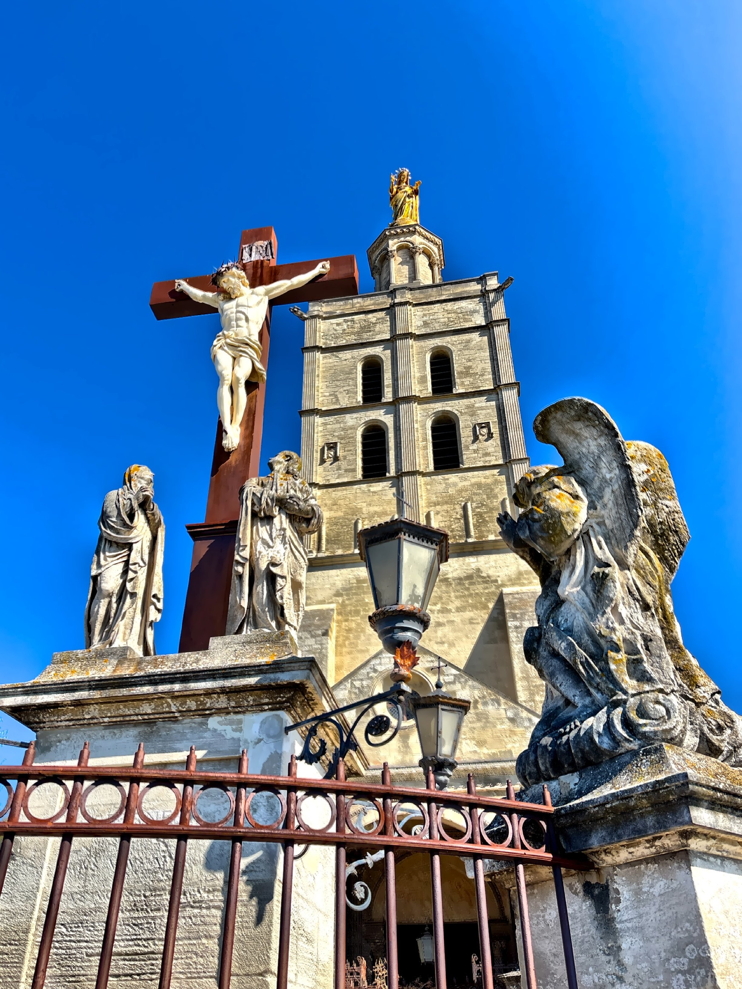  The soaring tower crowned by a large gilded statue of the Virgin Mary. 