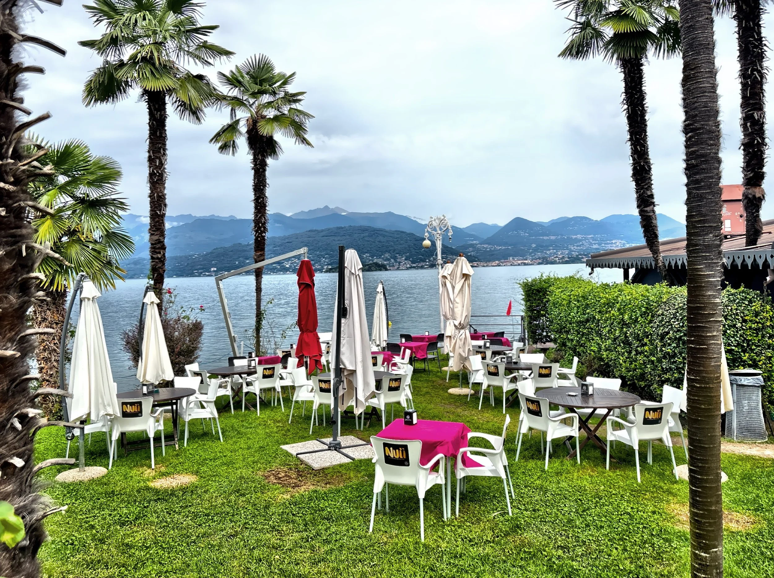  The long, beautifully maintained  lakefront promenade with manicured gardens and views toward the Alps. 