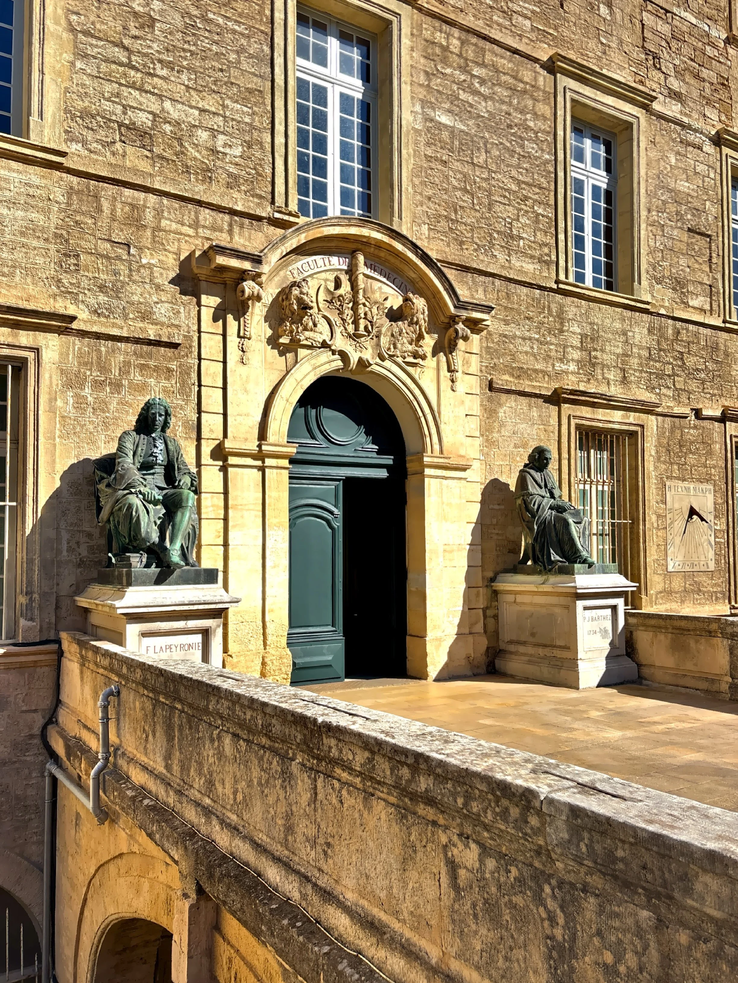  The entrance to the Faculty of Medicine is flanked by bronze statues of two famous figures from the school’s history: Francois de Lapeyronie, a prominent surgeon and physician Paul Joseph Barthez.  