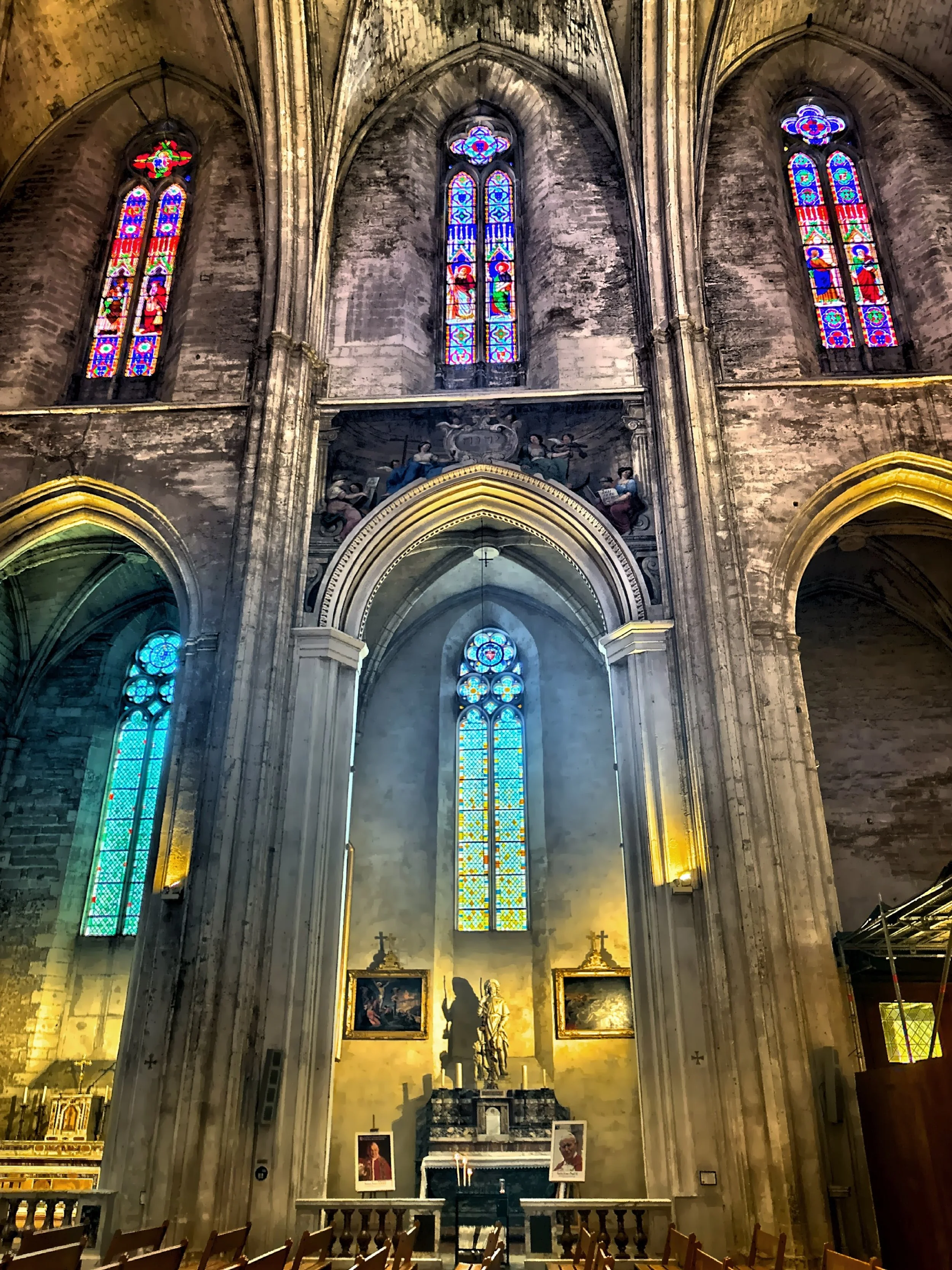  Inside, the cool Gothic nave glows with soft stained-glass colors, a calm refuge from the sun. 