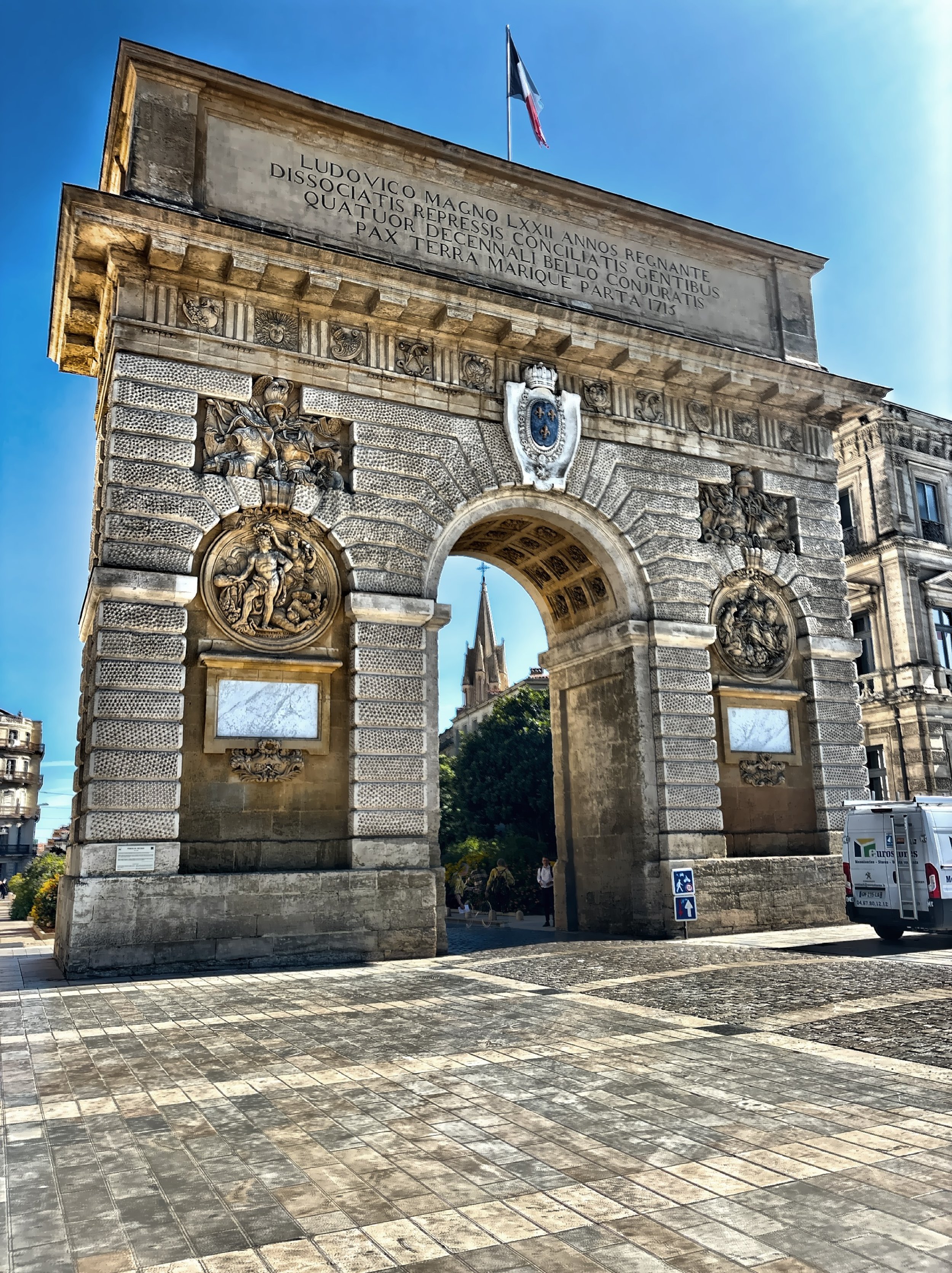  Promenade du Peyrou with palm trees and a regal arc de triomphe. 