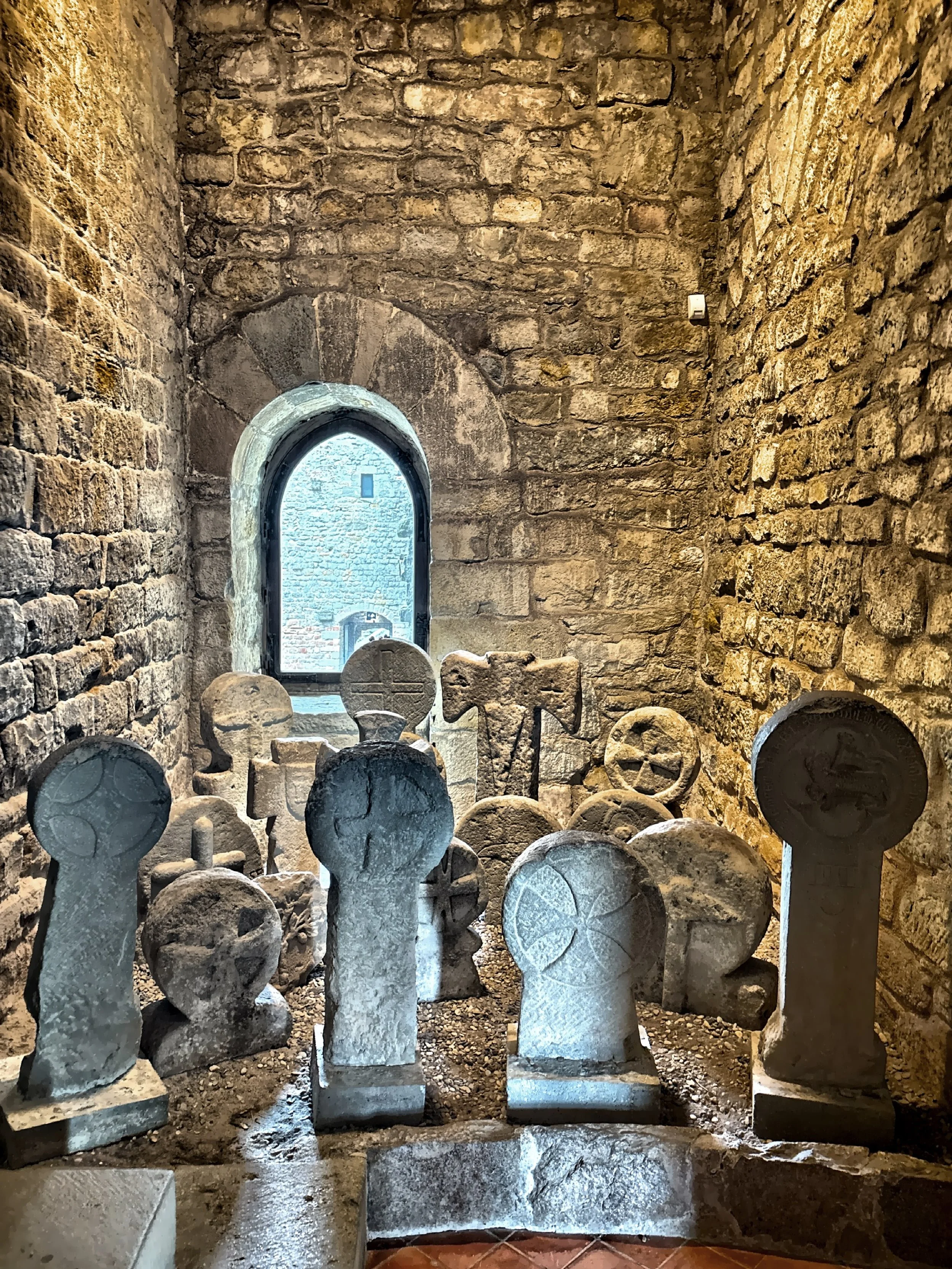  A collection of ancient gravestones on display.  