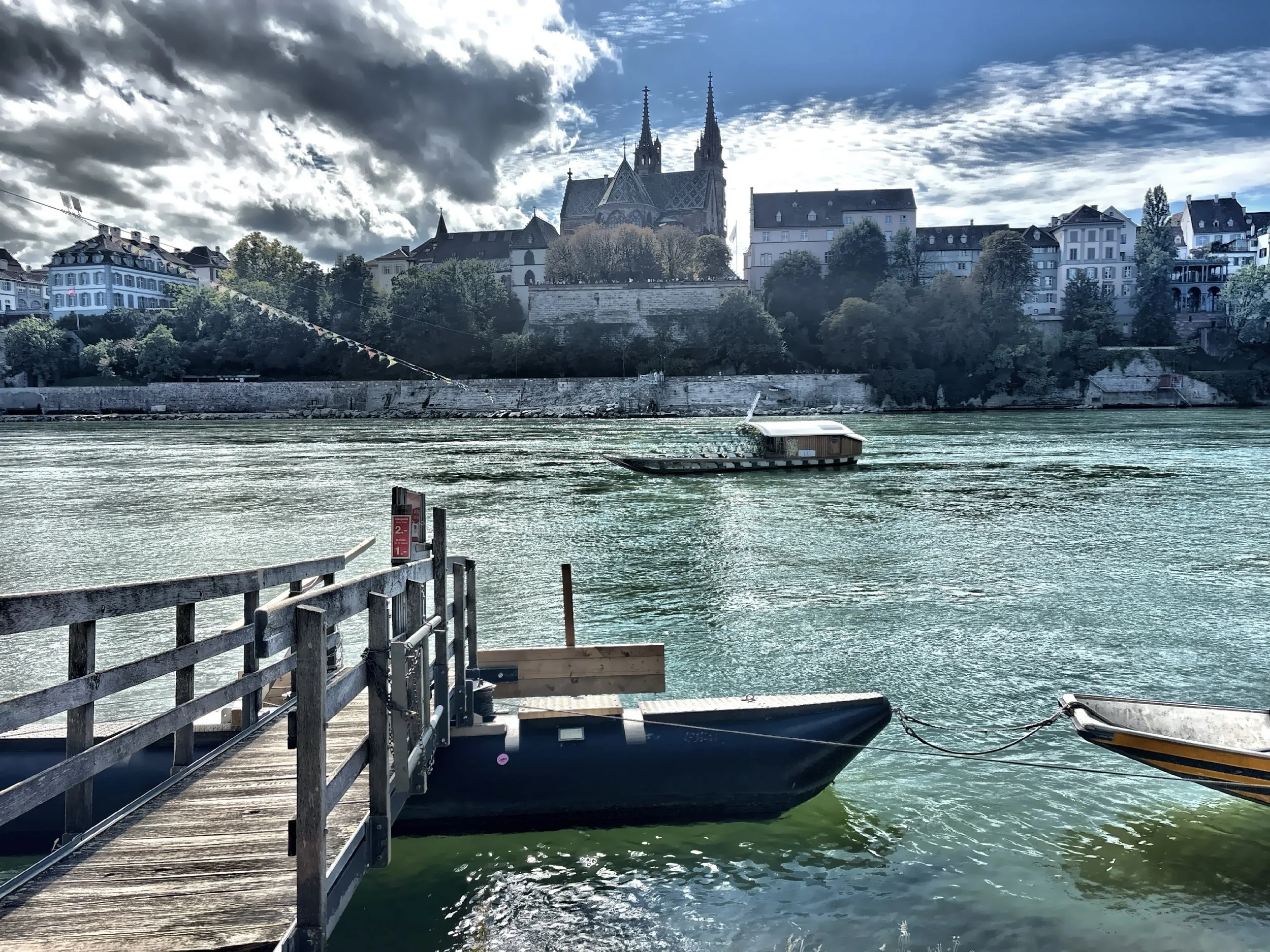  This ferry is one of the simplest and most charming ways to cross the Rhine. A small motionless boat glides quietly across the river using an overhead cable. 