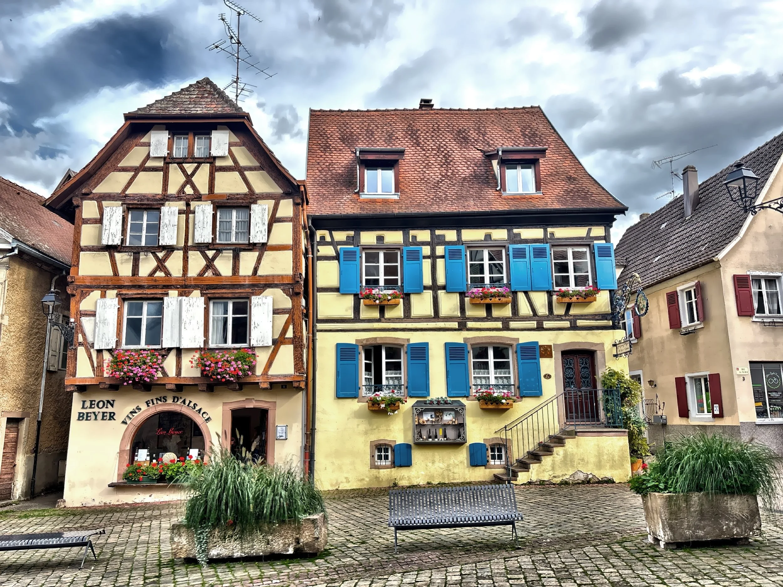  Bright shutters, flower-filled windows, and half-timbered houses define Eguisheim’s storybook charm. 
