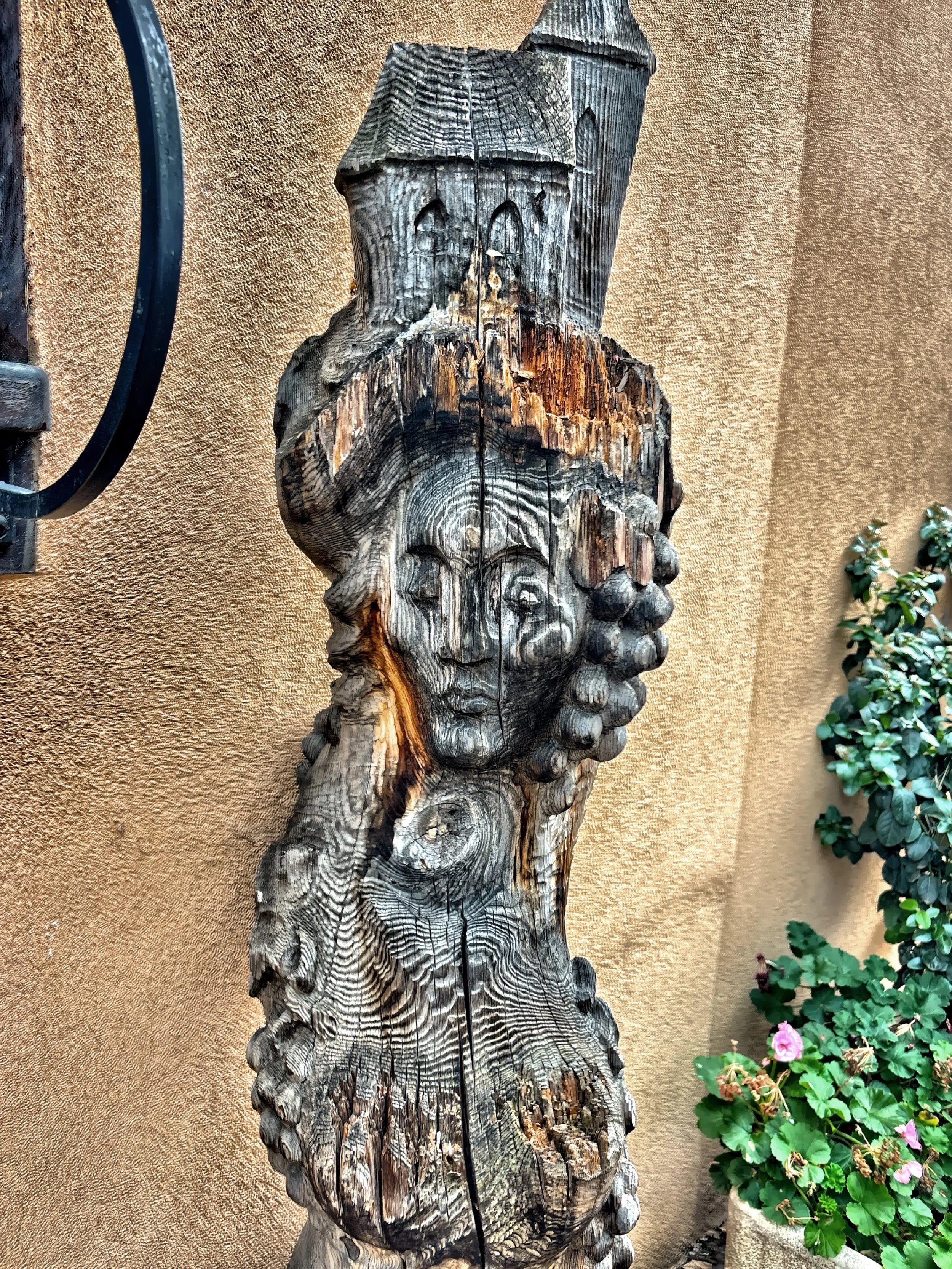  A hand-carved wood spirit sculpture. 