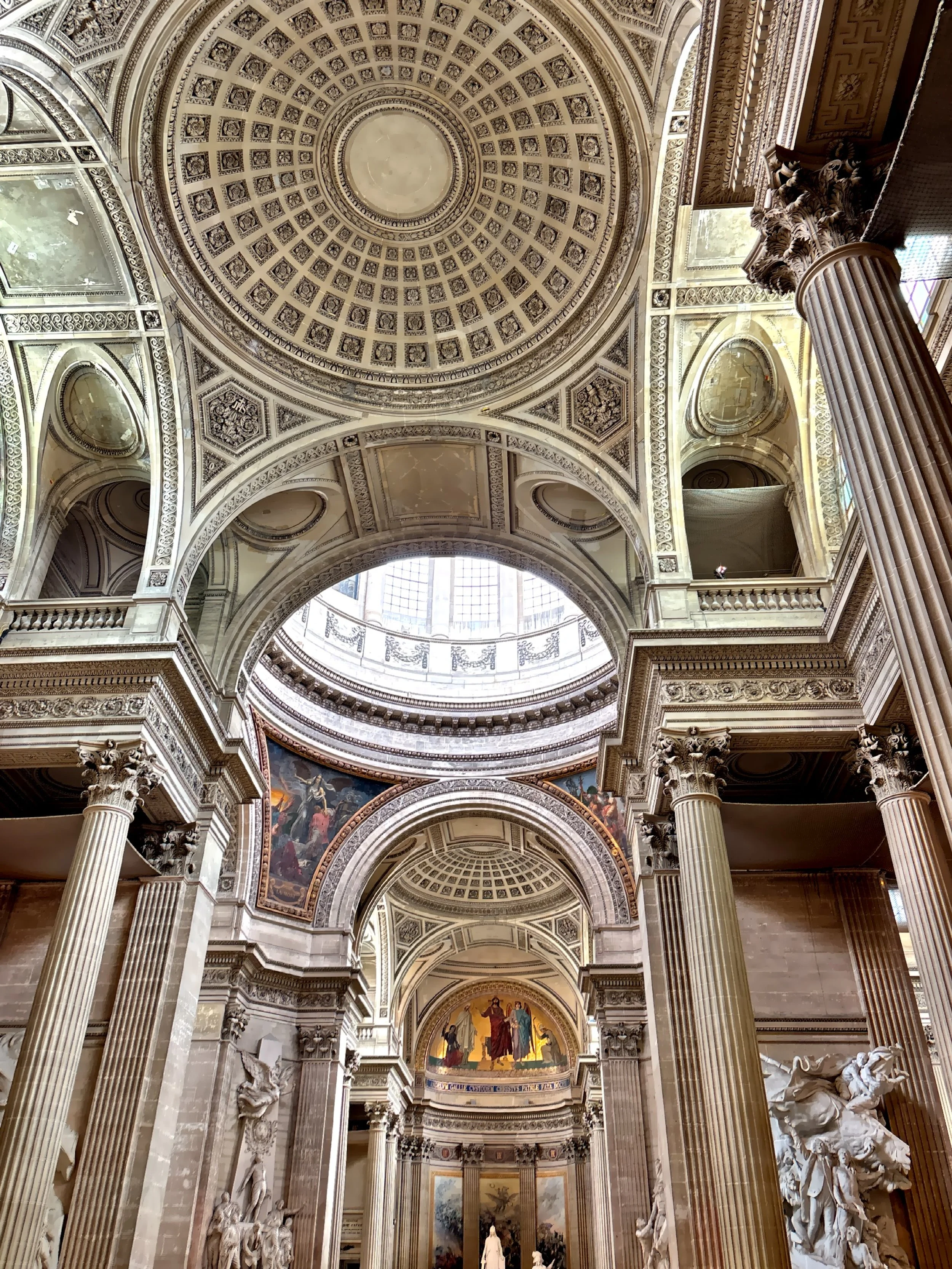  The interior features intricate architectural details, including ornate arches, columns and painted murals. 