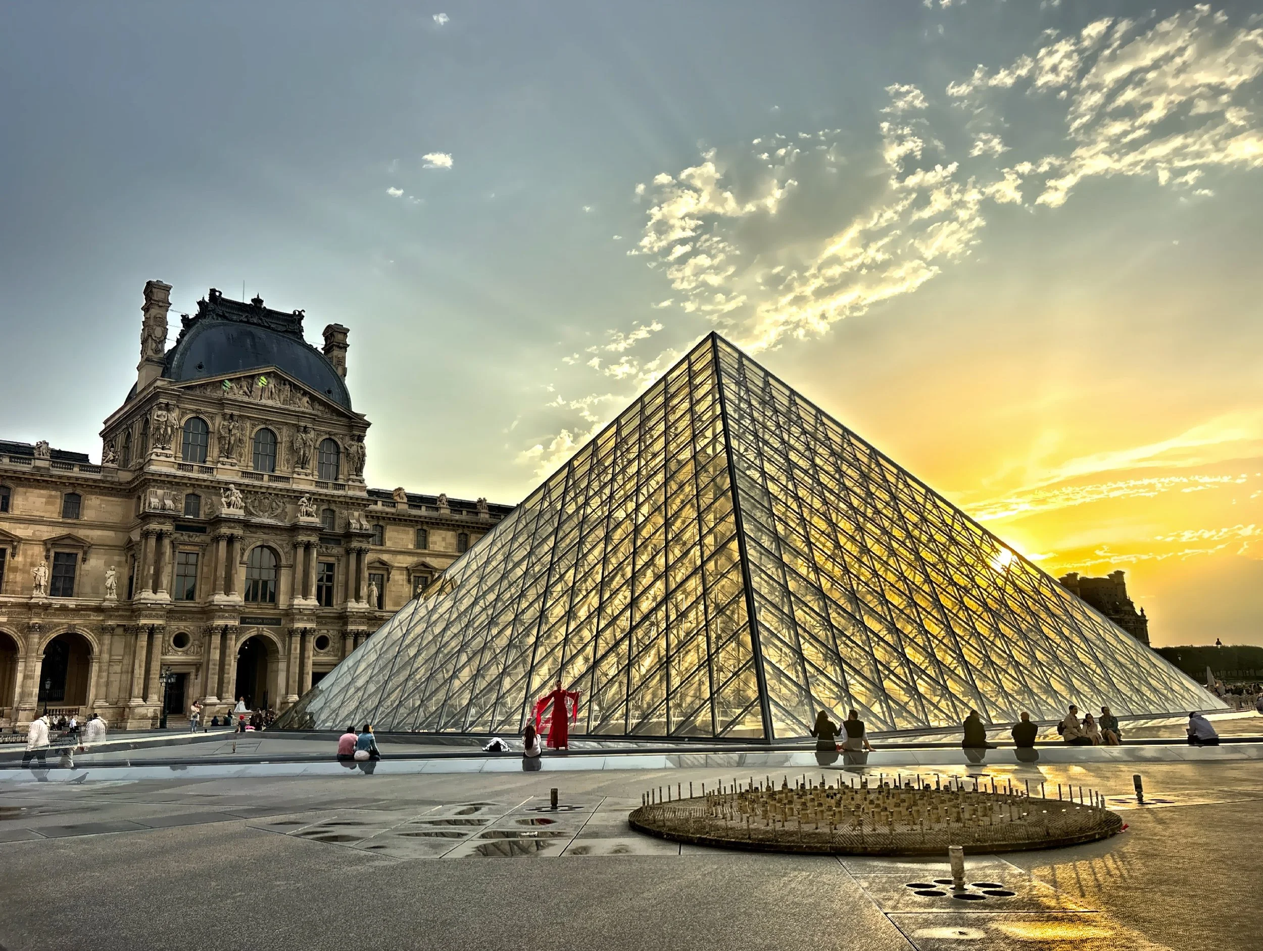  The famous Louvre Pyramid is a large glass and metal structure designed by Chinese-American architect I. M. Pei, completed as part of the Grand Louvre modernization project. 