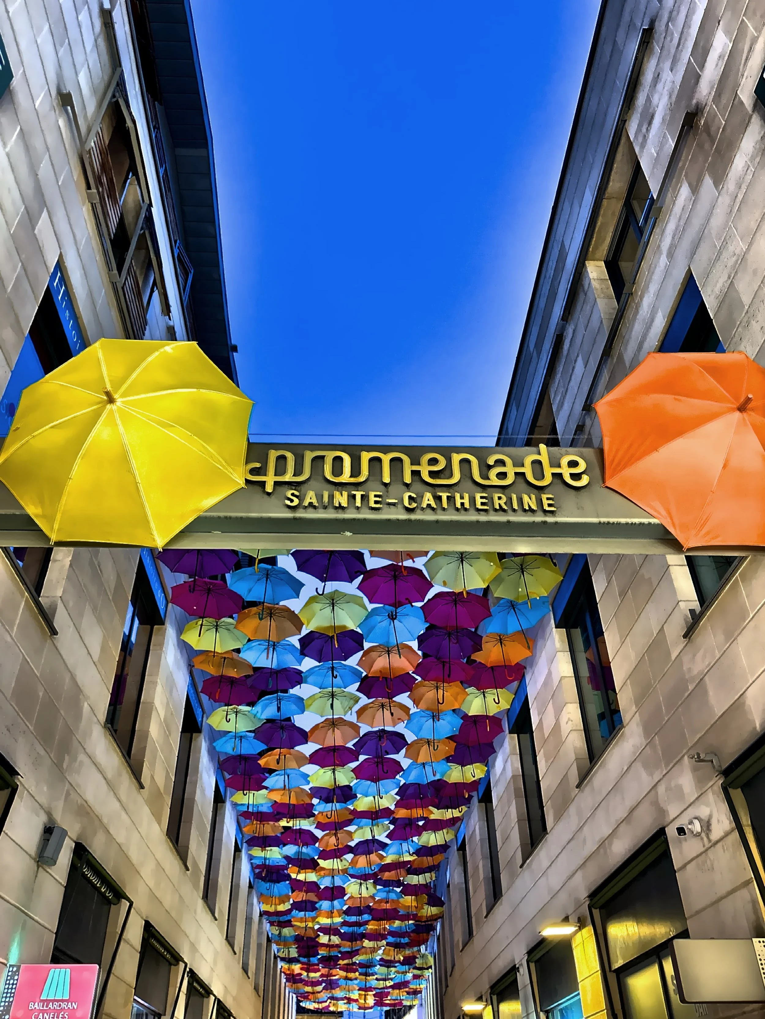  The entrance to the Promenade Sainte-Chatherine with a vibrant umbrella art installation.  