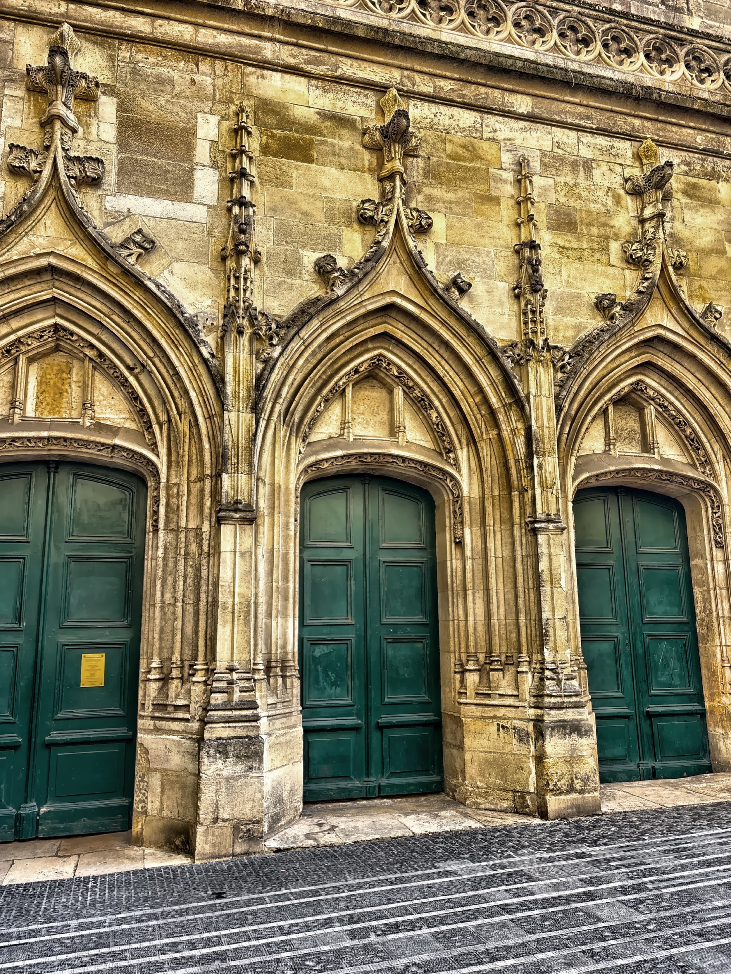  The green doors of Saint Eloi Church which was rebuilt in the middle of the 14th century. 