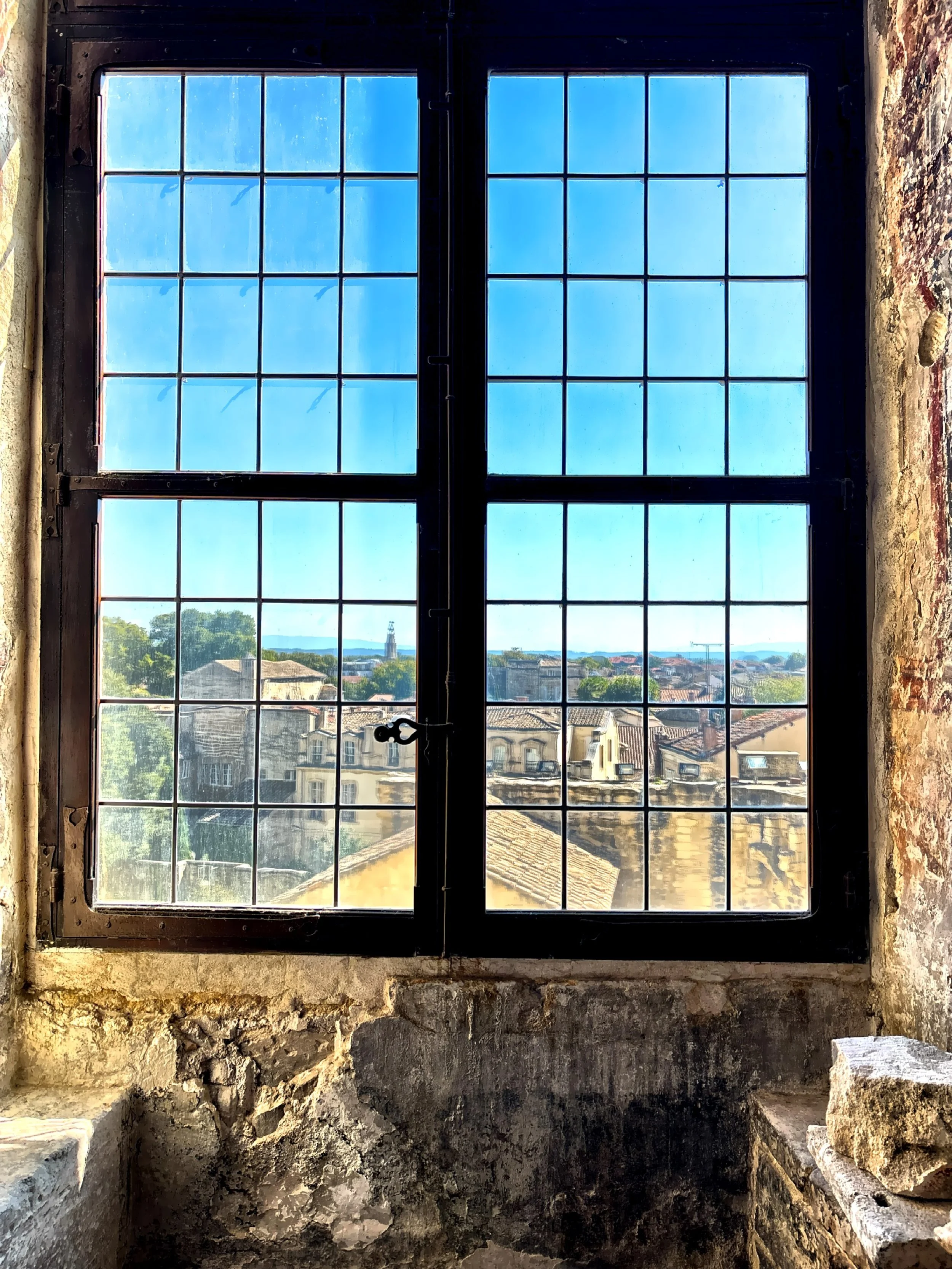  From the upper rooms the view over the city of Avignon and the Rhone River is breathtaking, offering a peaceful contrast to the palace’s heavy, imposing architecture. 