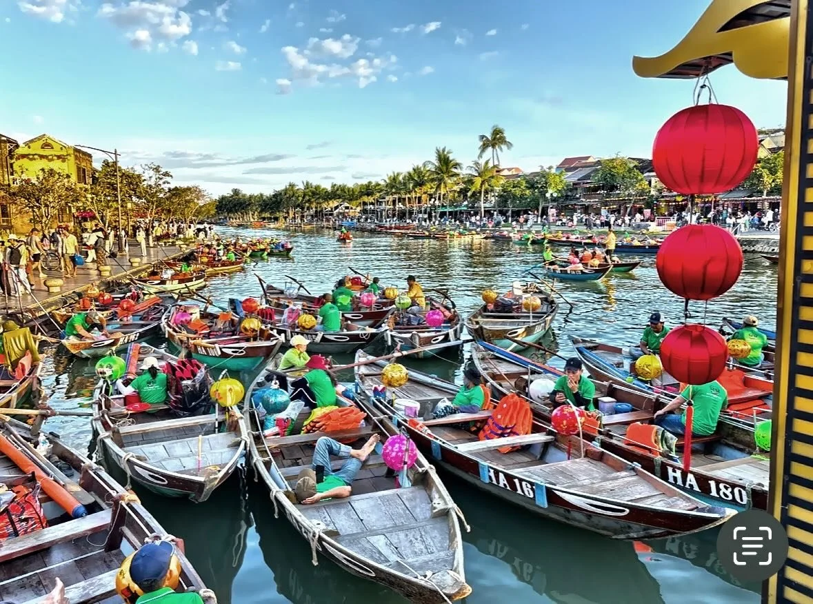 The vibrant traditional lantern boats on the Thu Bồn River in the ancient town of Hội An, Vietnam. Hội An Ancient Town is a UNESCO World Heritage site, recognized as a well-preserved example of a Southeast Asian trading port. #laternboats #hoianvietn