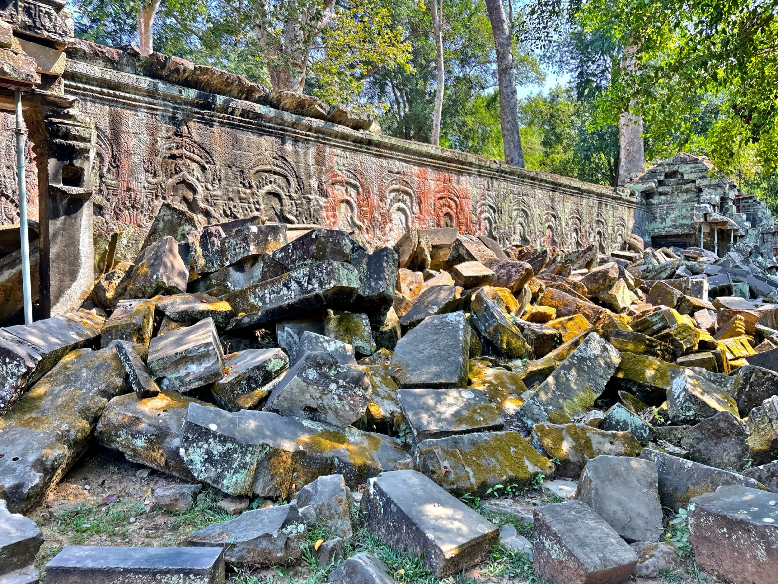  Echoes of the Khmer empire hidden beneath the rubble.  