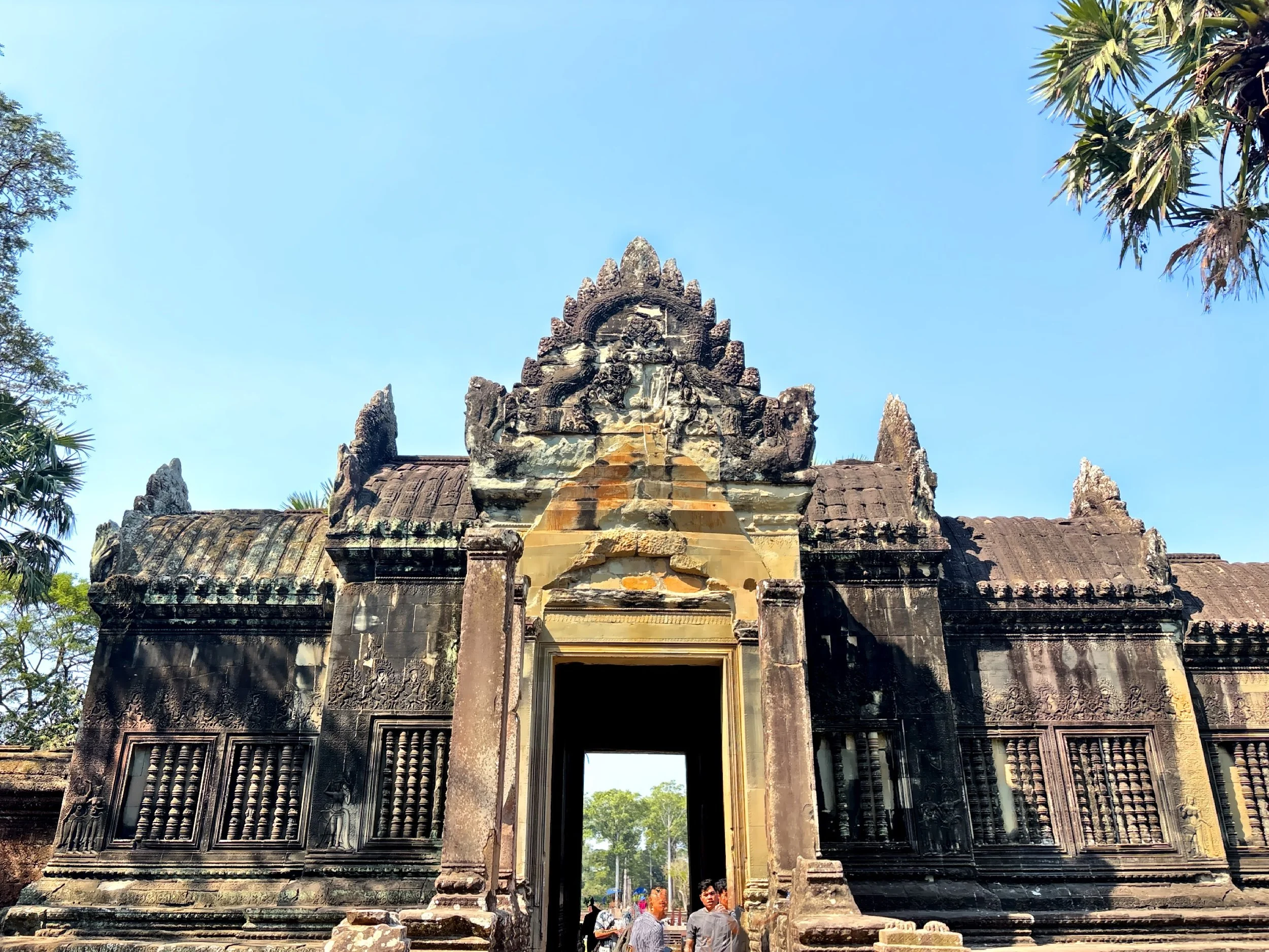  The sandstone gateway framed by intricate Khmer carvings.  