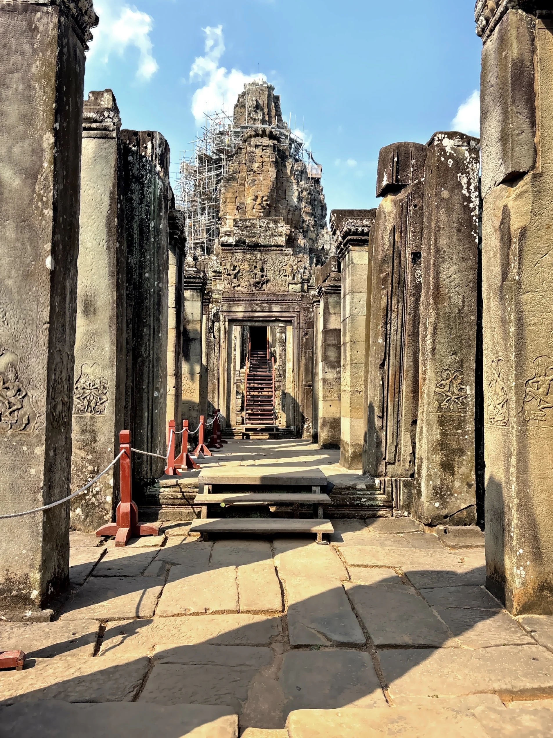  Framed through a crumbling doorway, a single tower rises in perfect symmetry. 