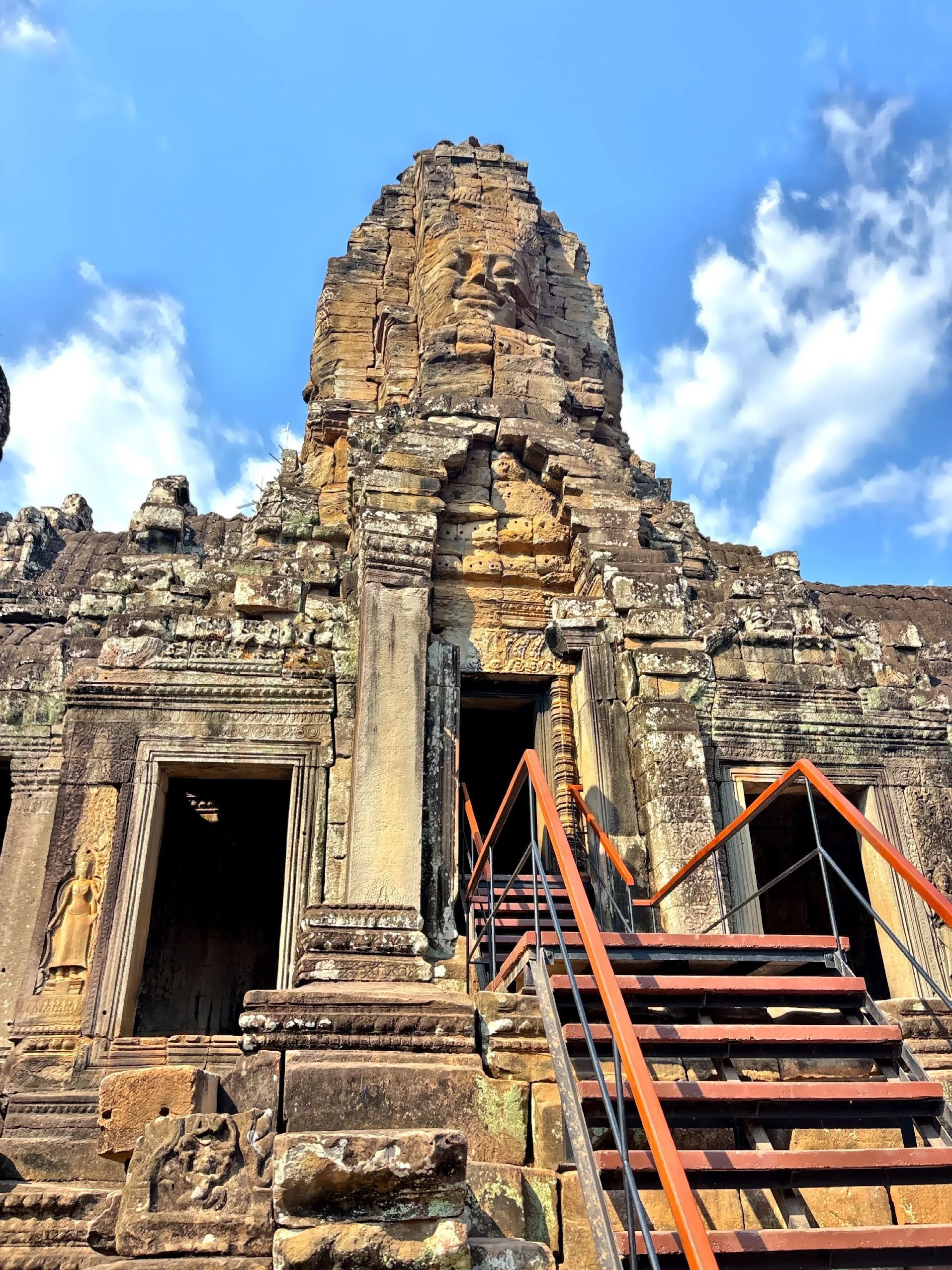  A moment of stillness beneath a towering face that has witnessed empires rise and fall. 