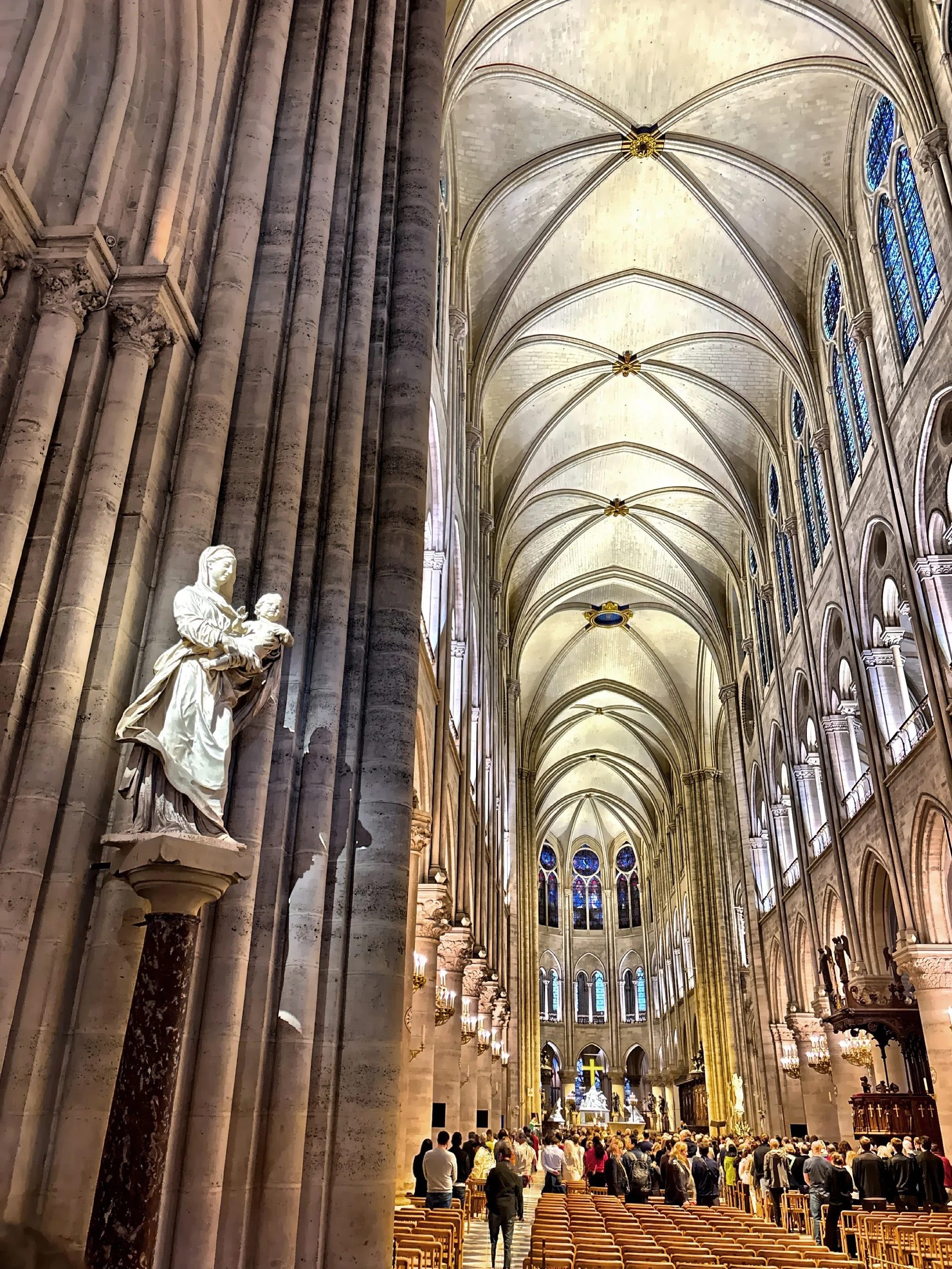  Interior view showing the nave, pointed arches, and ribbed vaults typical of Gothic architecture. 