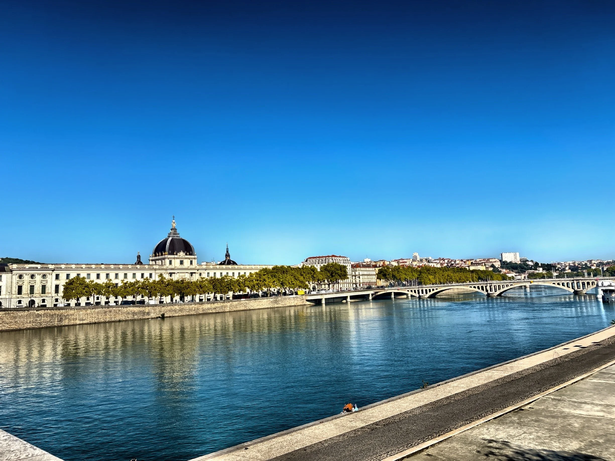  Daytime and nighttime views of the historic Hotel-Dieu de Lyon, located on the banks of the Rhone River.  The building, originally established in the 12th century, served as a hospital until 2010. 