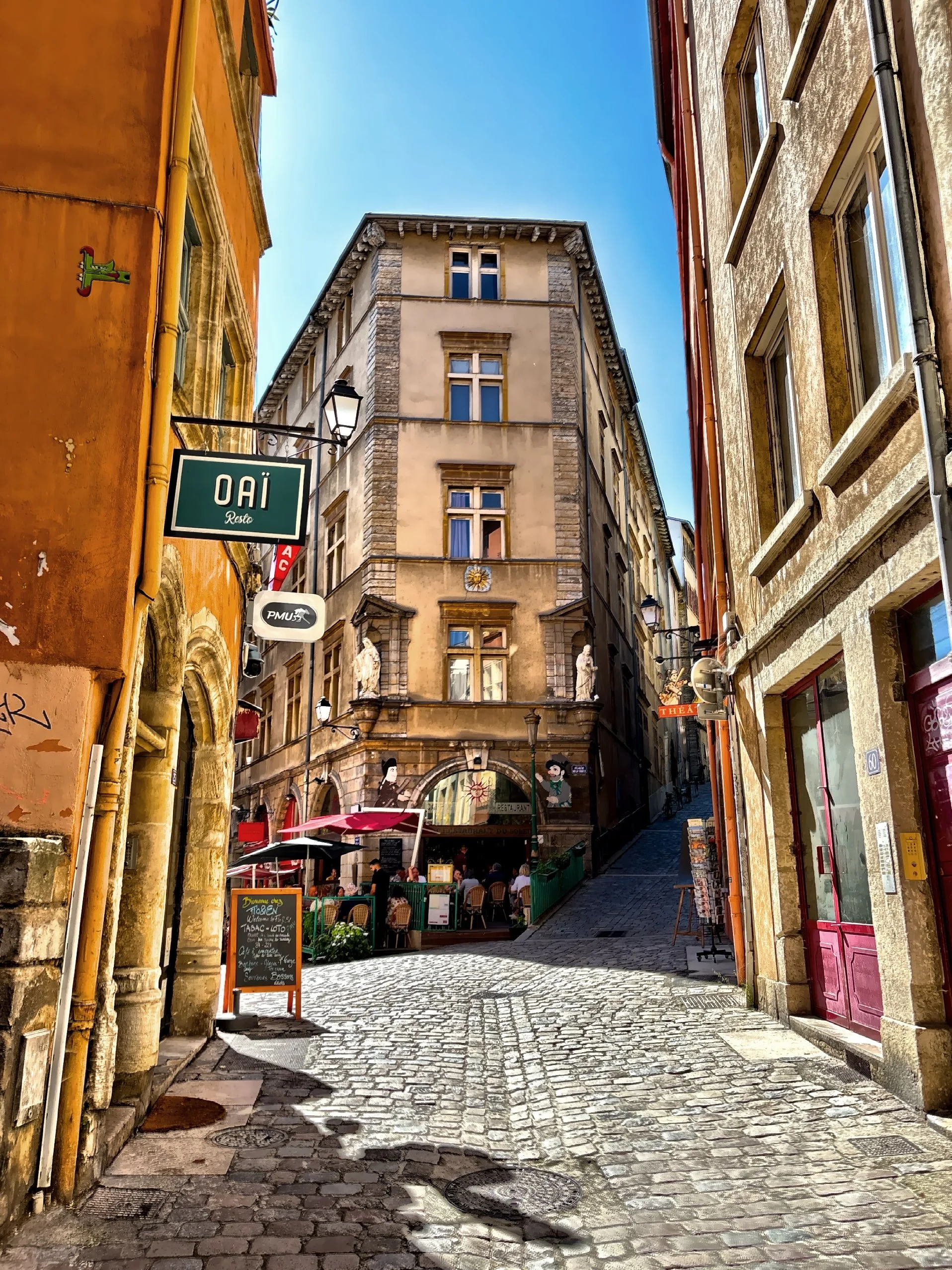  Place de la Trinite, a historic square surrounded by old buildings in Old Lyon. 