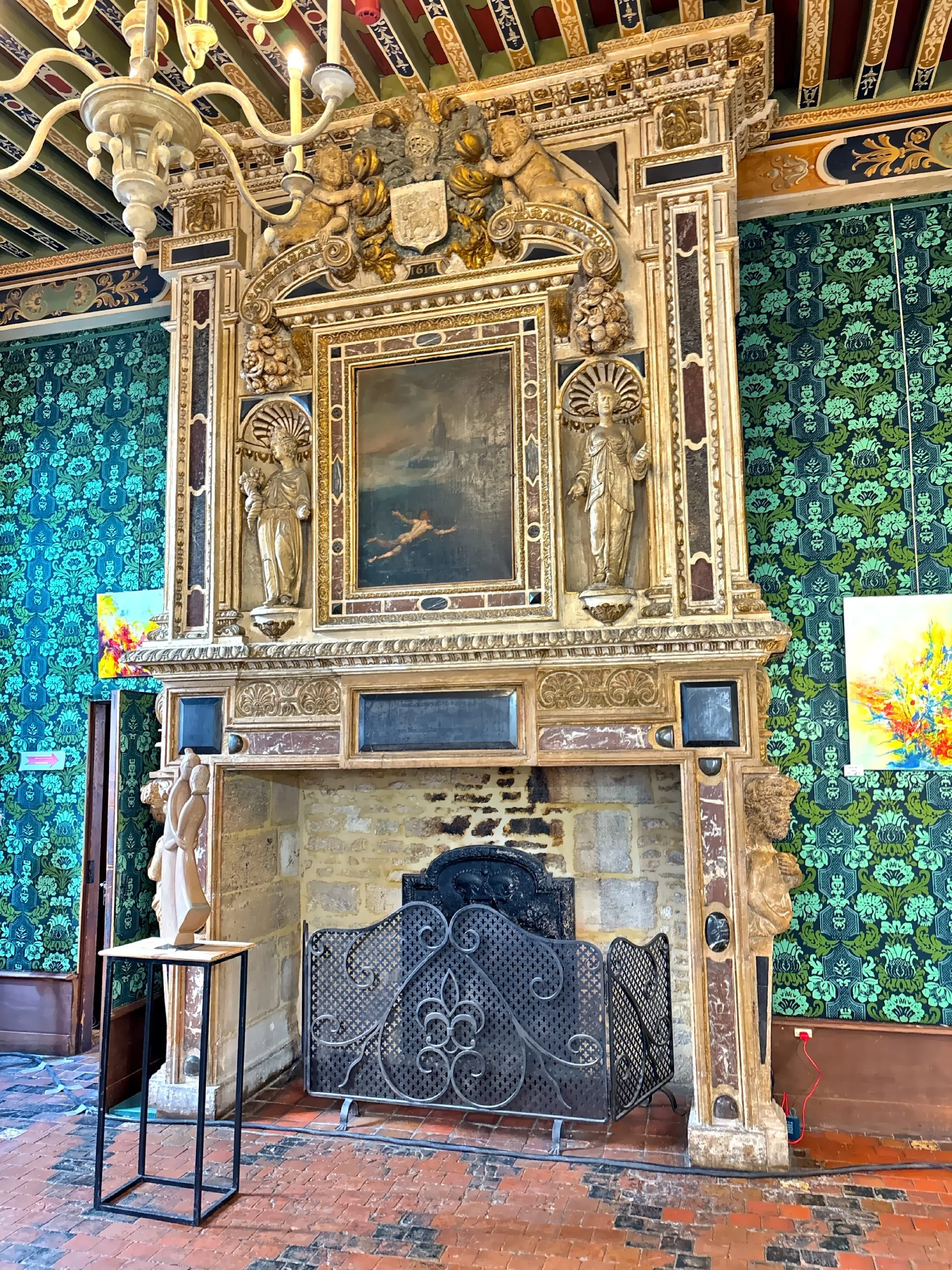  The interior of Hotel de Vogue with ornate fireplace.  Built around 1614 for Etienne Bouhier, today the building often hosts temporary exhibitions. 