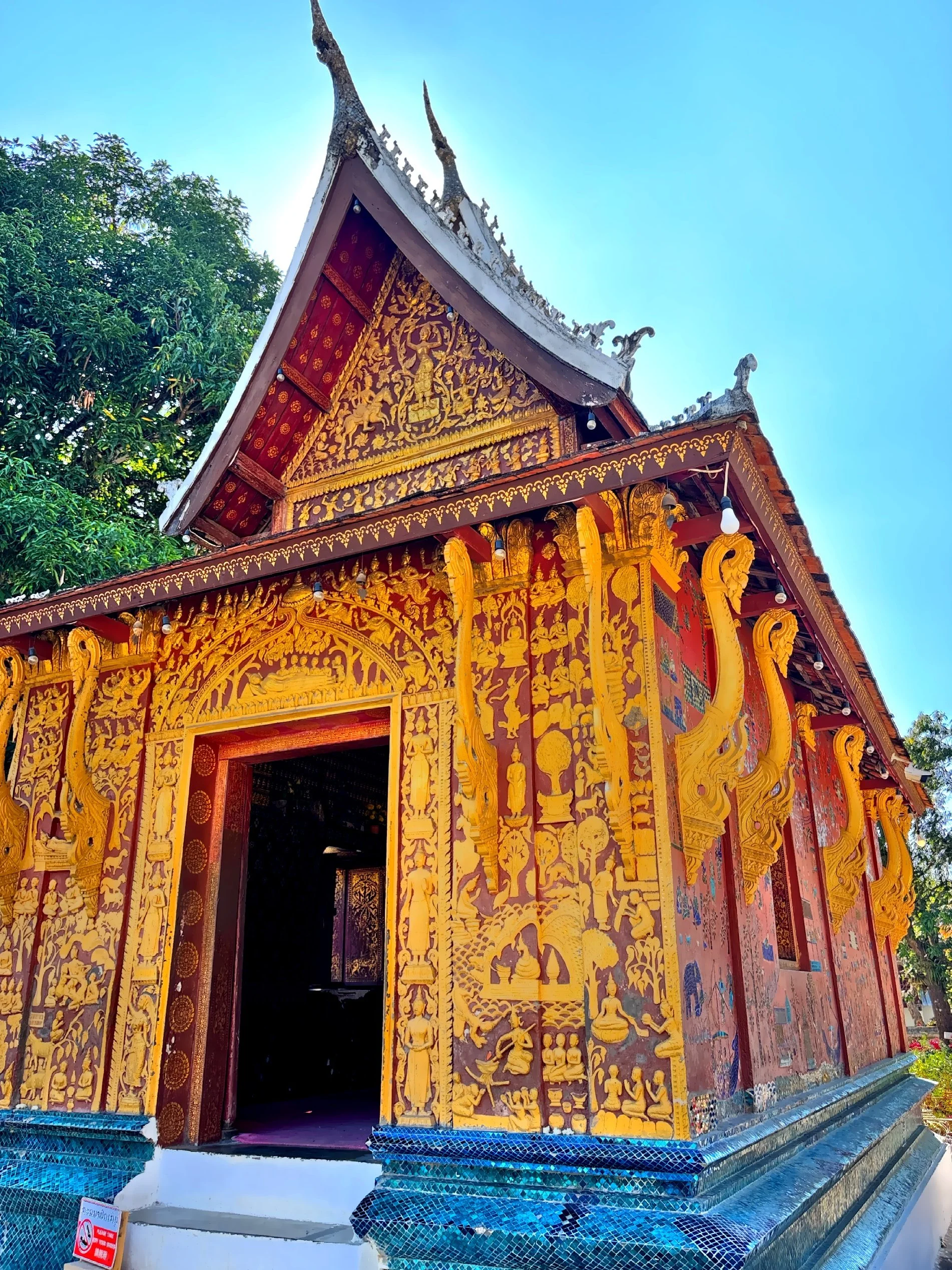 The Funeral Chapel, also known as the Red Chapel is small but highly ornate, reflecting traditional Lao Buddhist artistry.  Built in the 1960’s to house the royal funeral chariot of King Sisavangvong. 
