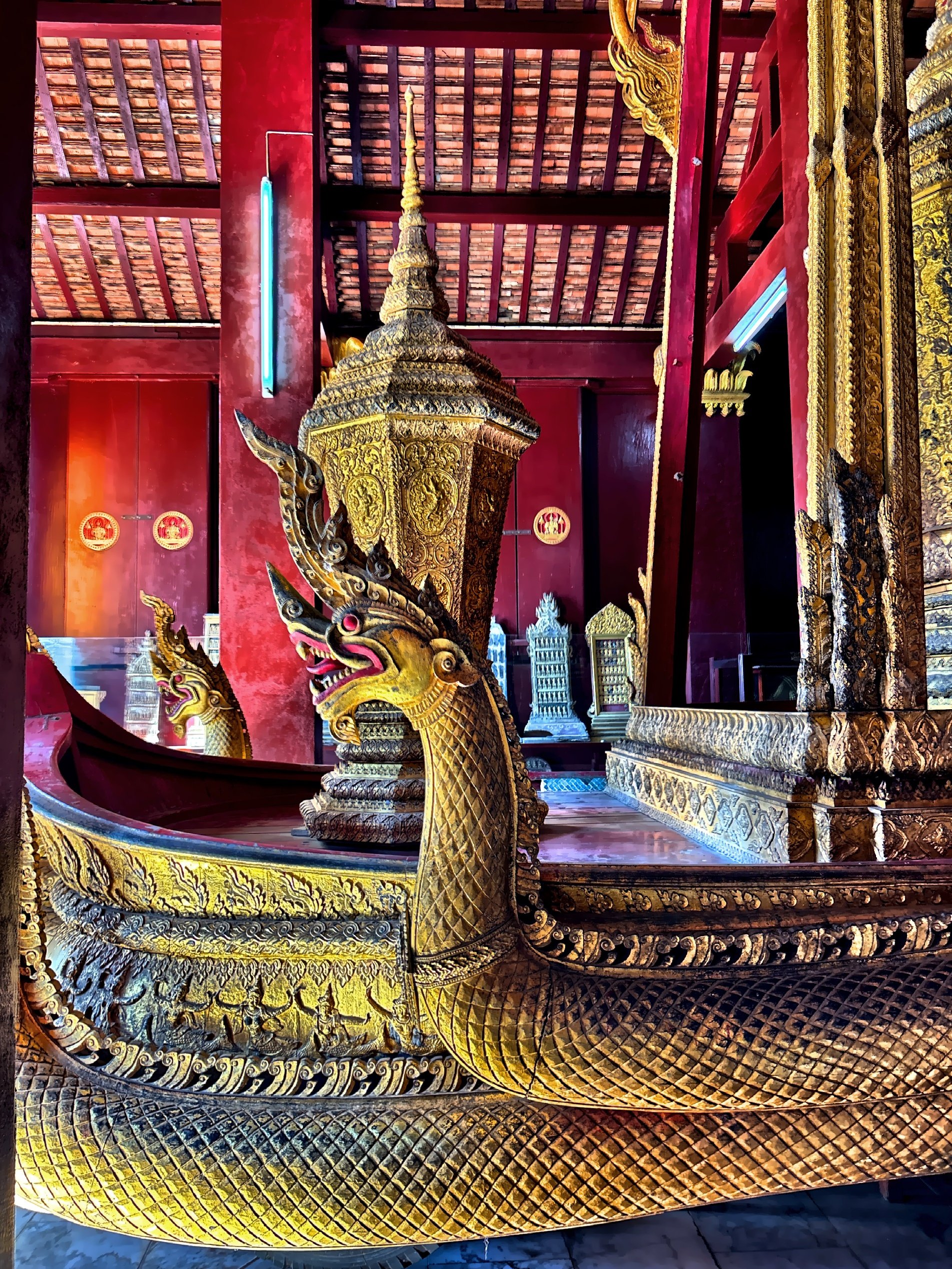  This carriage was used for royal funerals and features intricate carvings including seven serpent deities on the prow. 