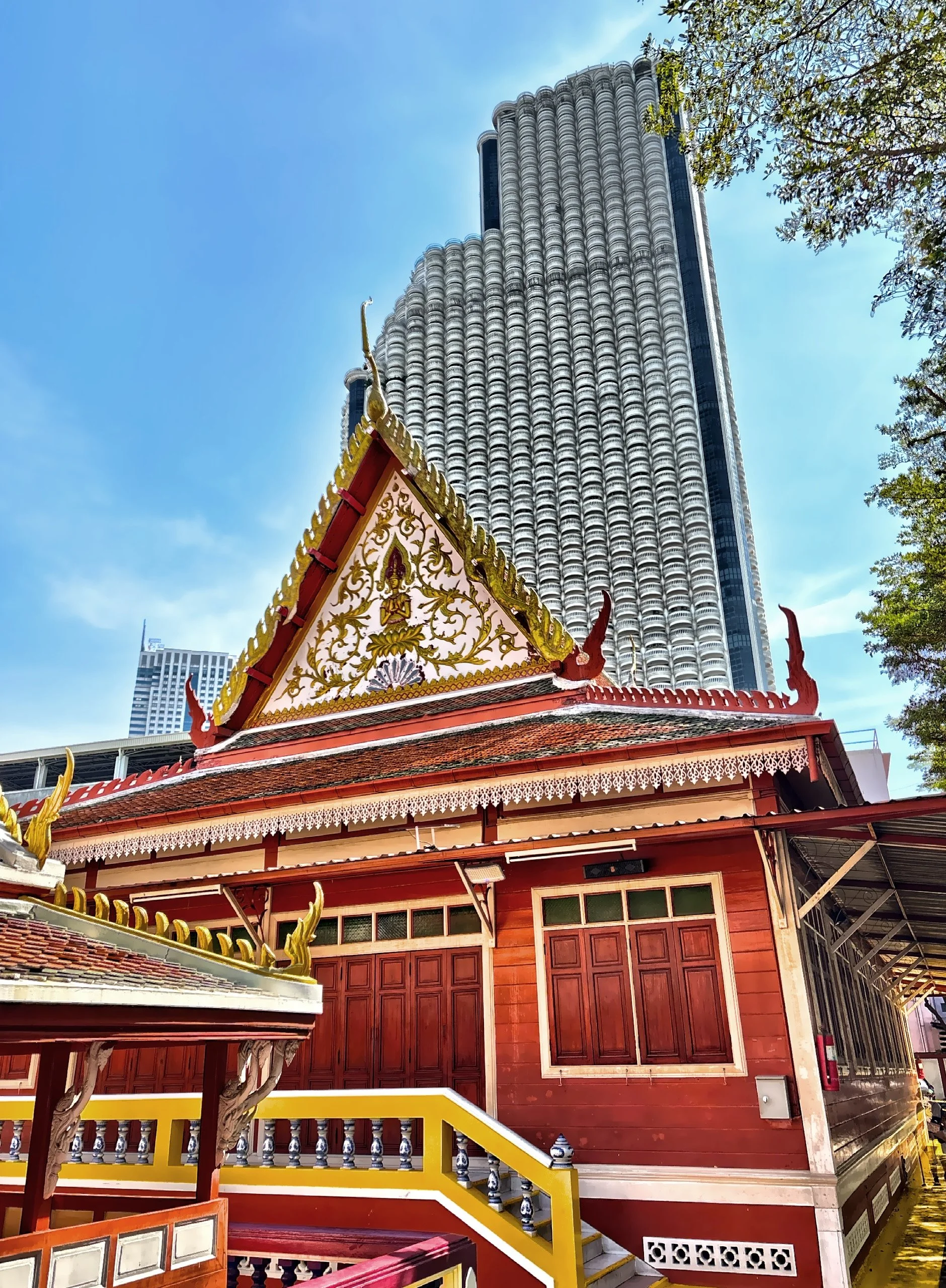  A view of the juxtaposition of historic religious architecture against modern city skyscrapers. This isn’t accidental—it reflects how Thailand has modernized without erasing its spiritual and cultural foundations. Religious architecture remains acti