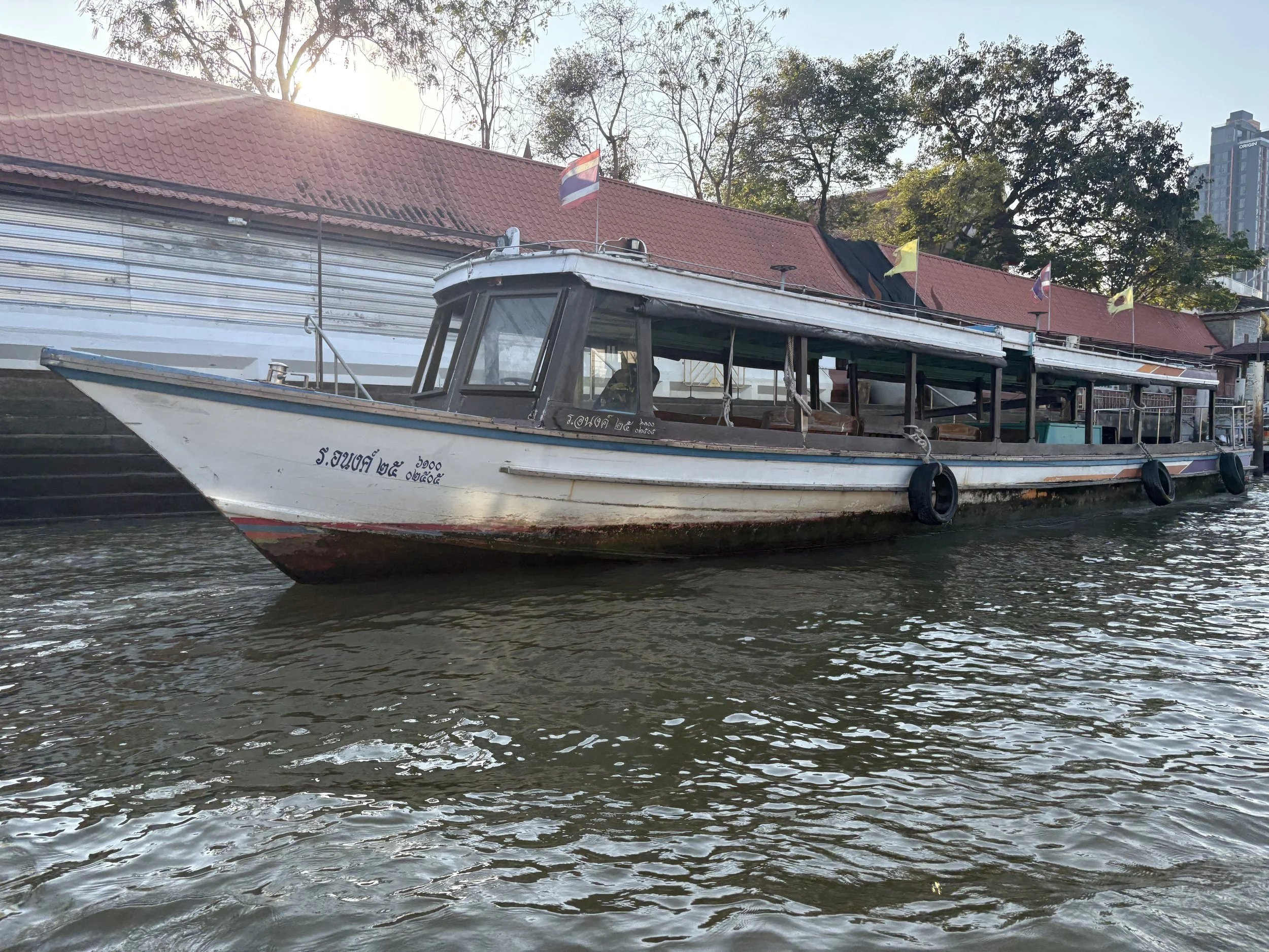  A traditional Thai boat commonly known as a water taxi or express boat. 
