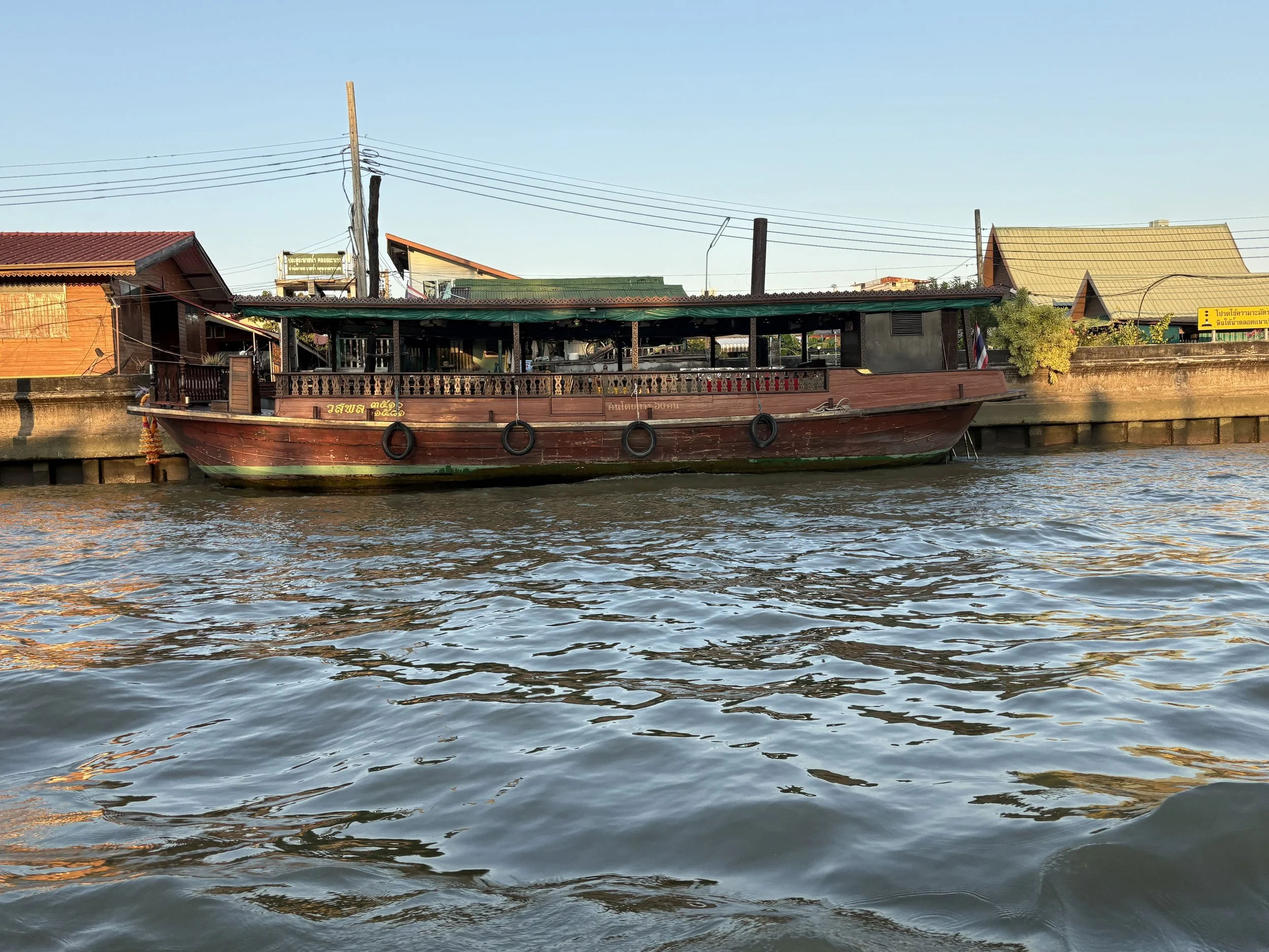  A restored wooden rice barge, historically used for transporting rice and other cargo. 