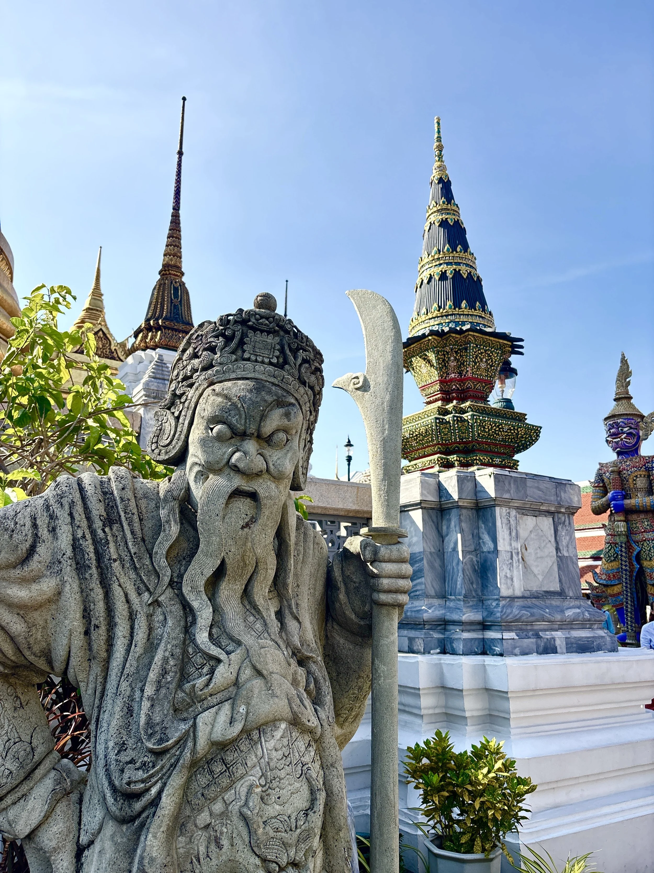  A traditional Chinese stone guardian statue serves as symbolic protectors of the temple grounds.   