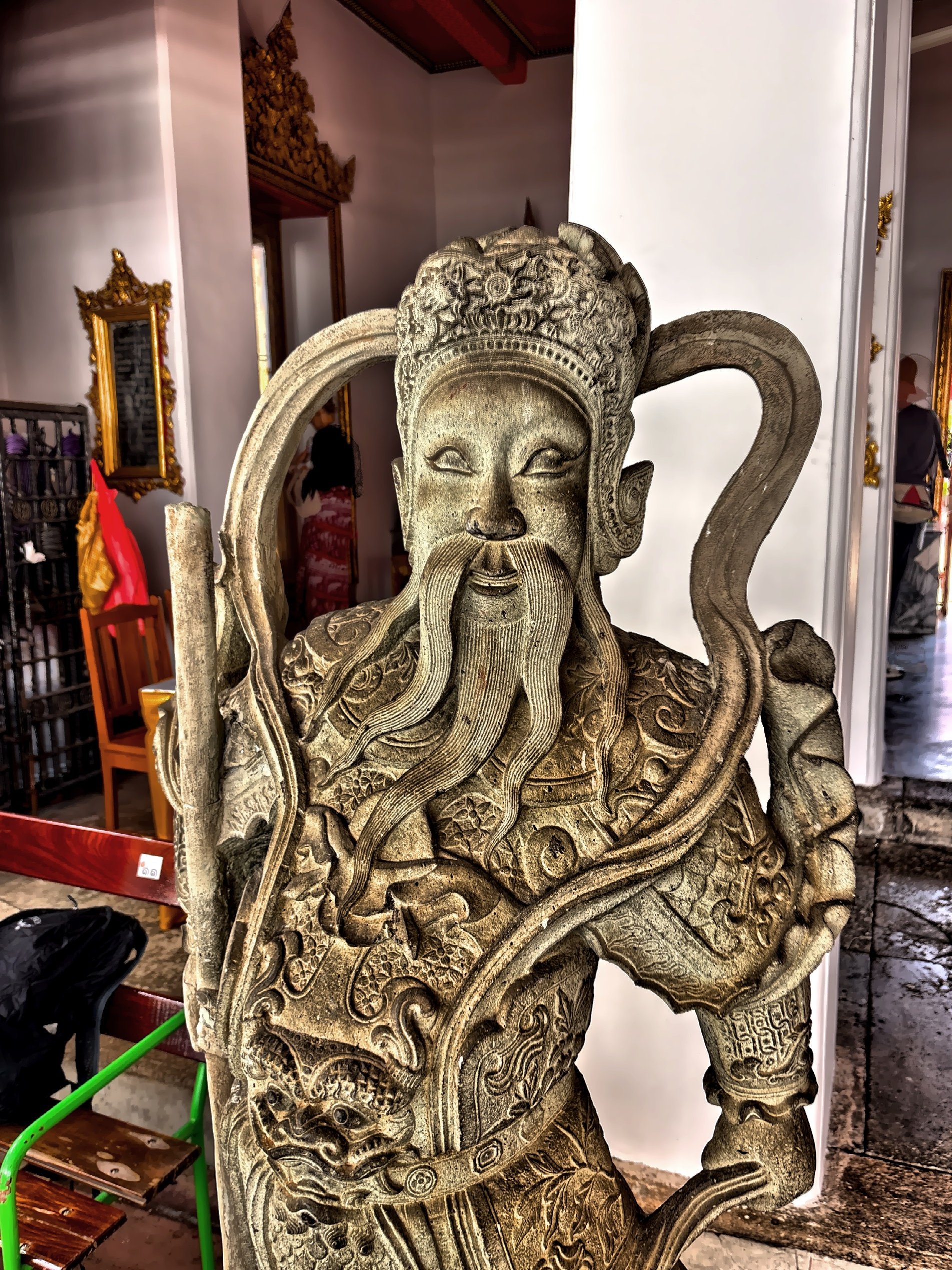  A traditional Chinese-style guardian sculpture often called ‘Chinese Giants’ or ‘Warriors'.  These statues were often originally imported from China as ballast in trading ships during the 19th century and repurposed as decorations for Thai temples. 