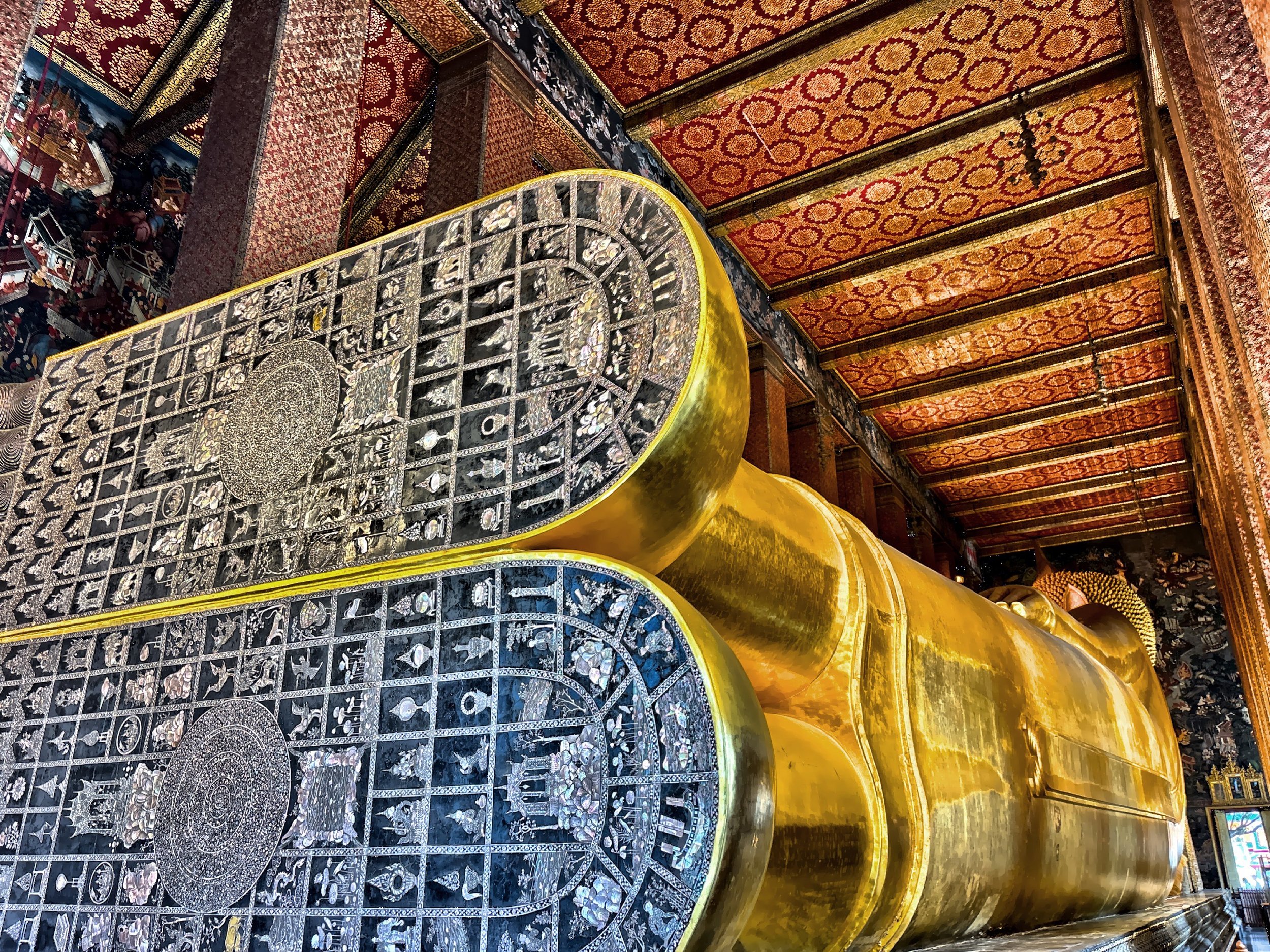  These are the soles of the Reclining Buddha’s feet which are inlaid with mother-of-pearl, depicting 108 auspicious symbols that represent Buddha’s divine nature. 