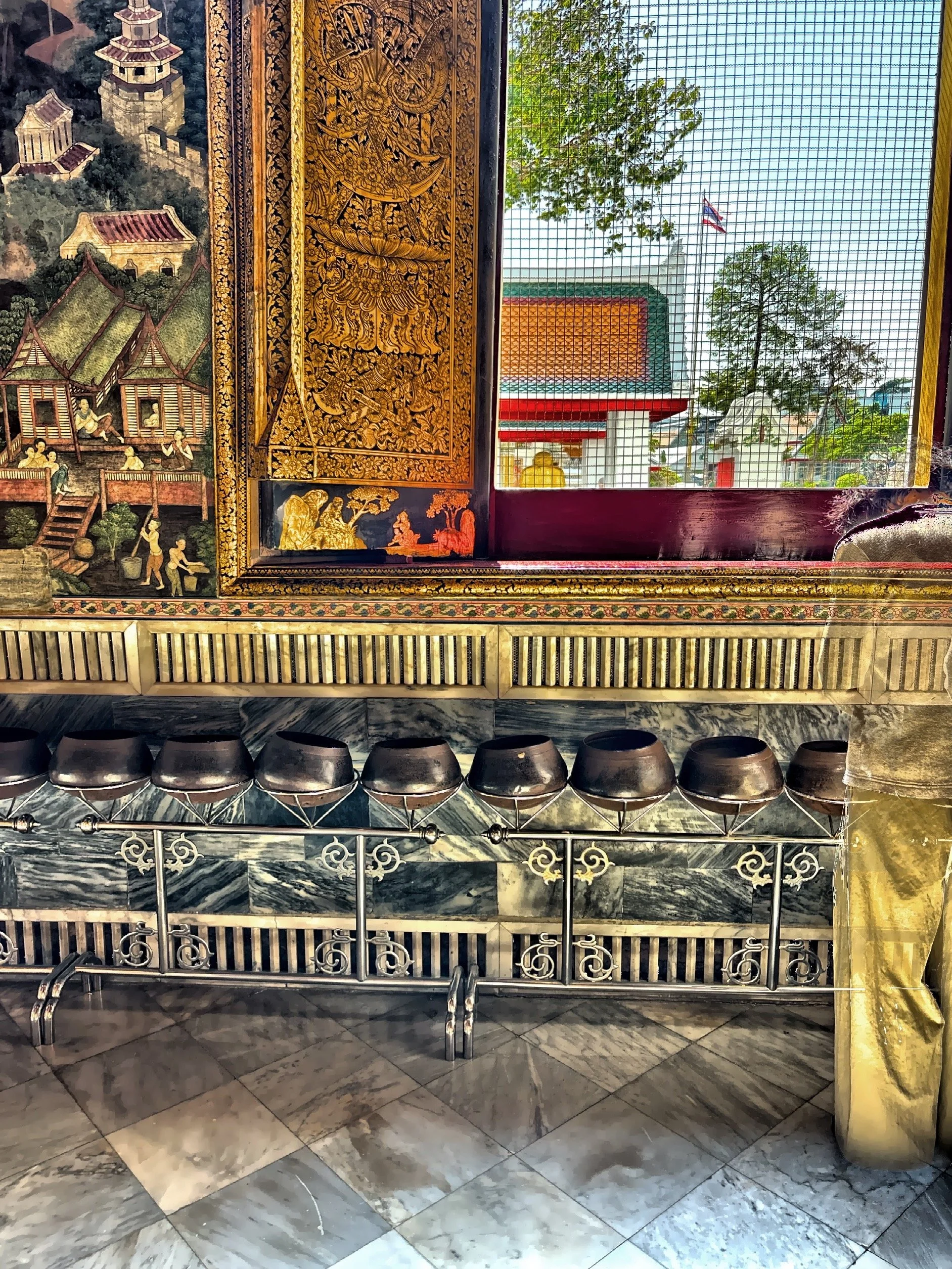  The 108 bronze fortune bowls located inside Wat Pho.  Each bowl represents one of the 108 auspicious characteristics of the Buddha. 