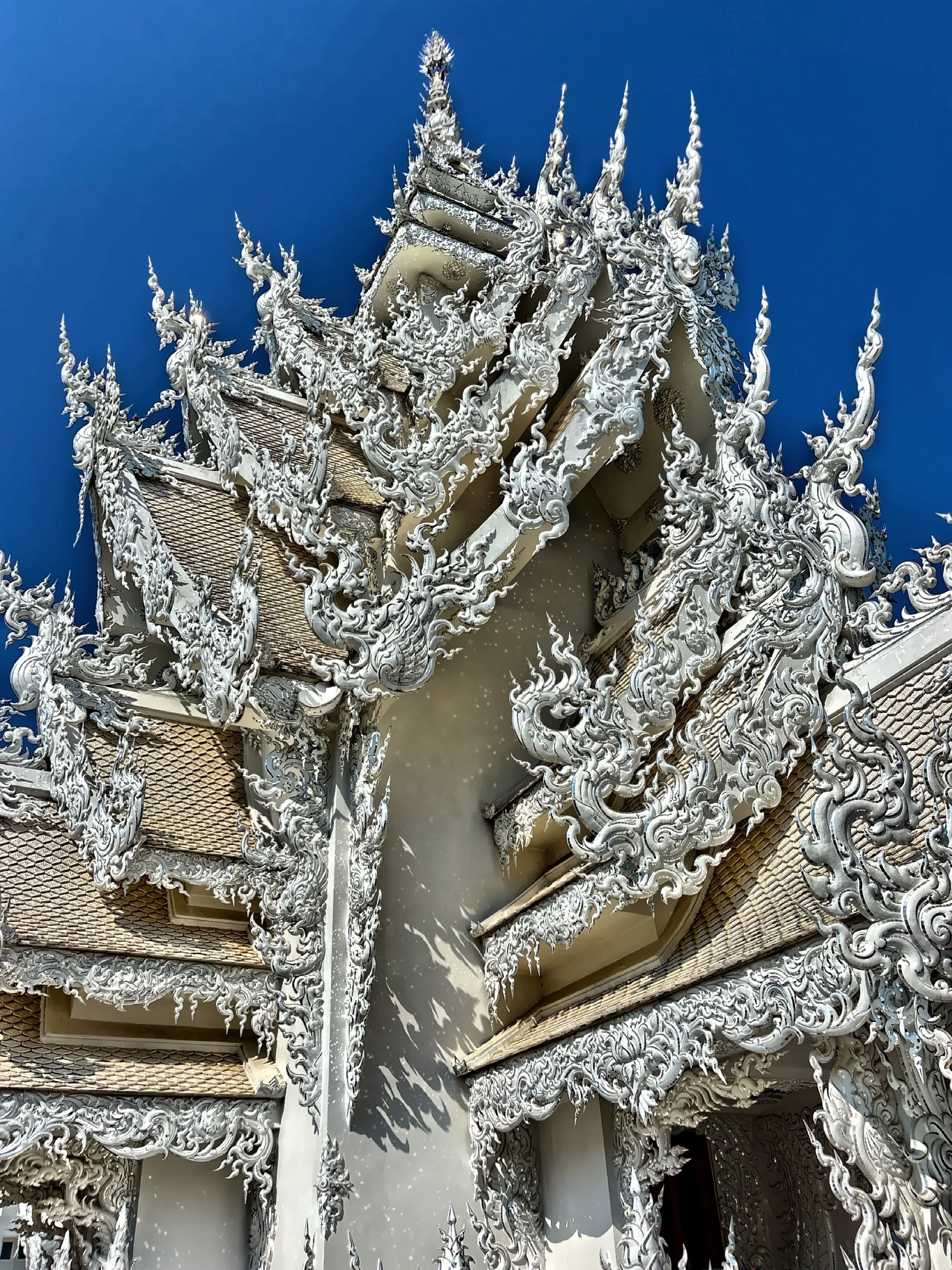  A mix of traditional Thai temple layout with contemporary, almost surreal art. 