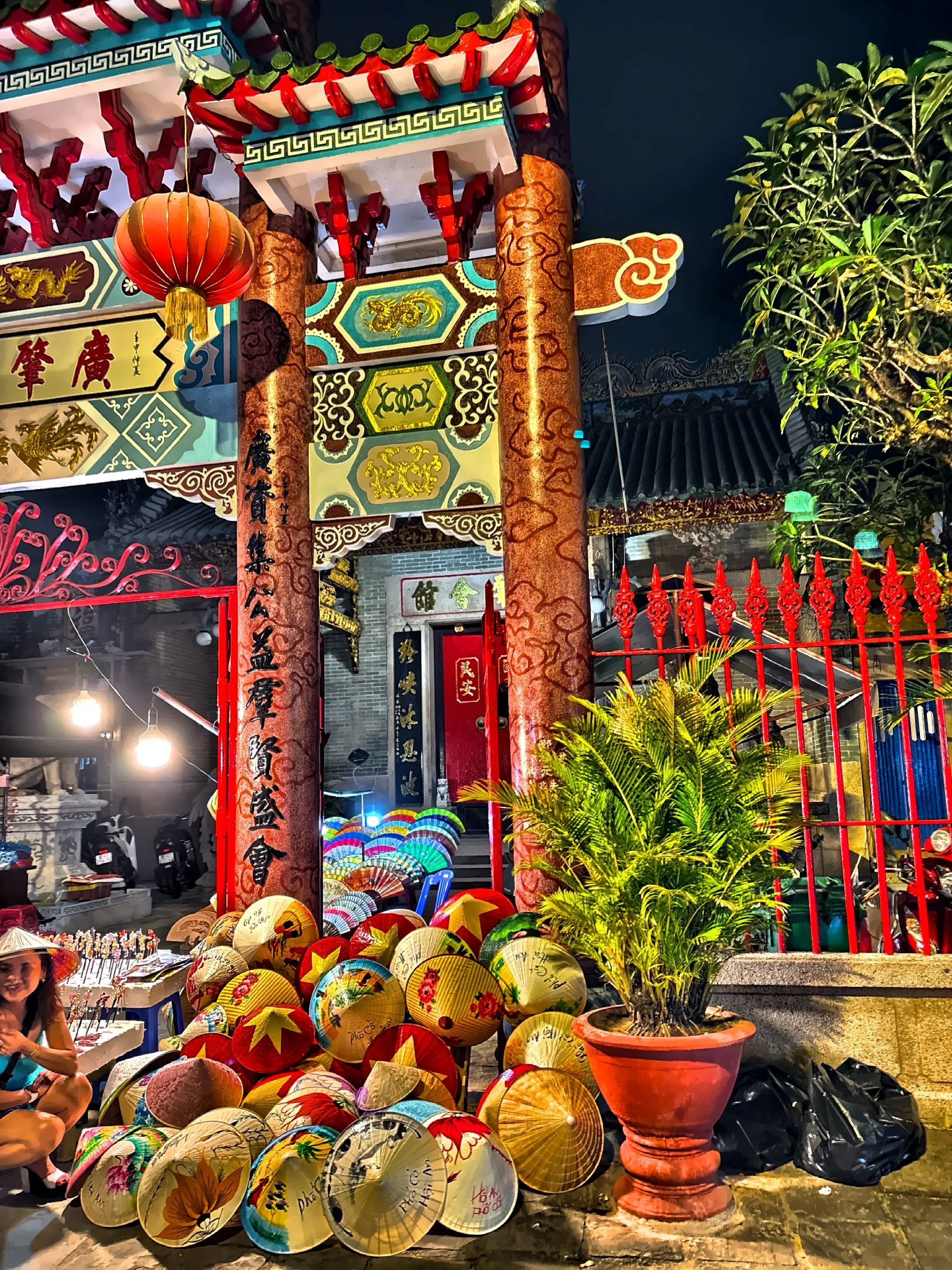  Large red pillars and decorative conical hats outside the Cantonese Assembly Hall. 