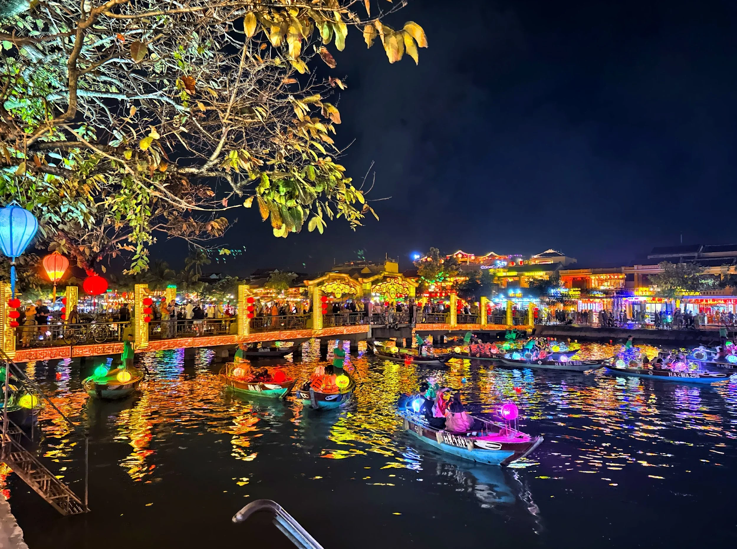  As the sun sets, hundreds of lanterns begin to glow, lighting up the town in soft reds, blues, and golds.  