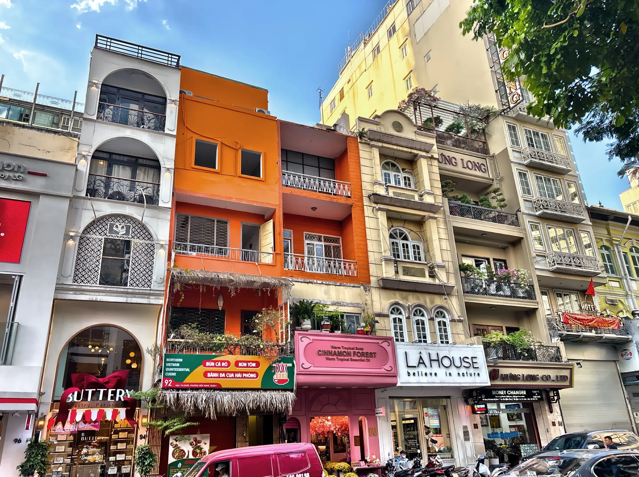  A mix of various businesses in narrow, multi story buildings. 