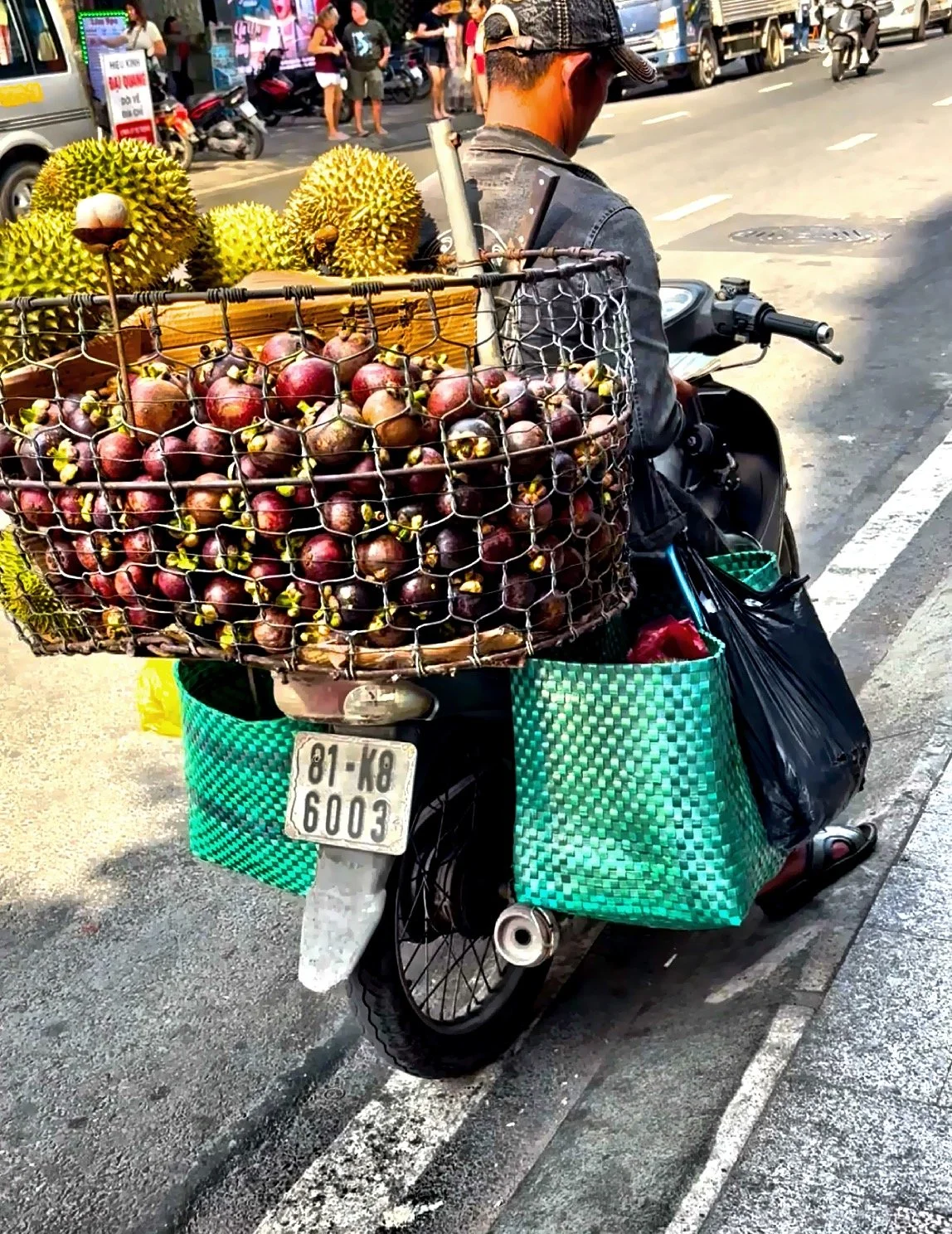  A vendor selling mangosteen and durian, two popular fruits here. 