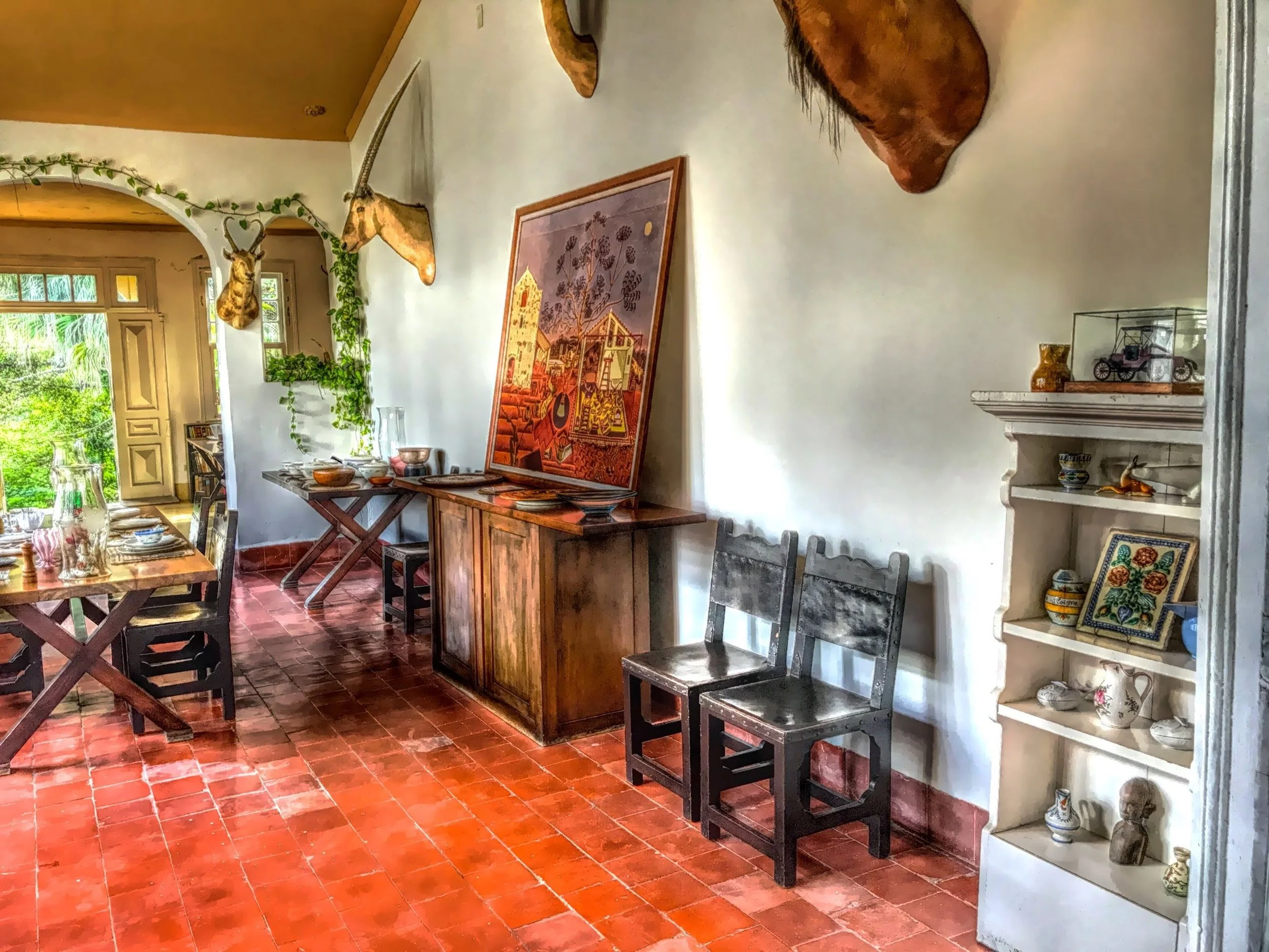  The dining room walls are decorated with Hemingway’s favorite painting ‘The Farm’ by Joan Miro as well as animal trophies from African safaris. 