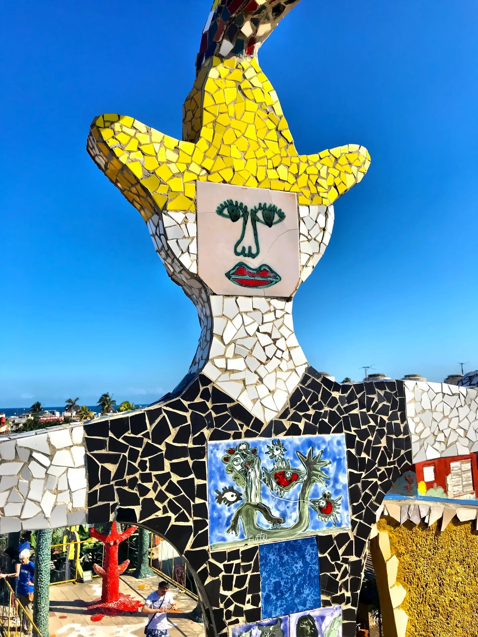  You’ll find towering sculptures made from broken tiles, political murals layered with symbolism, and fragments of poetry embedded into walls.  