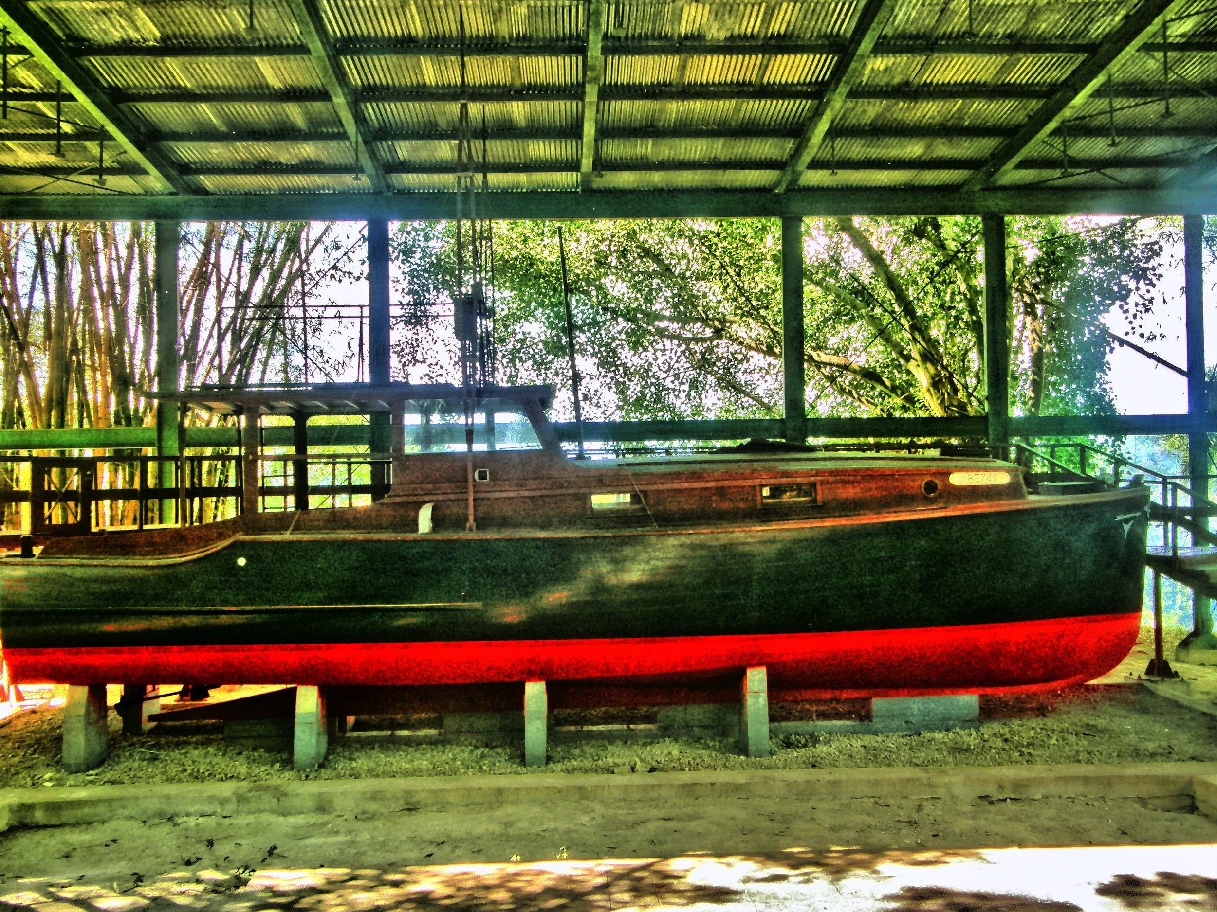  Pilar, his beloved fishing boat, resting quietly on the former tennis court. 