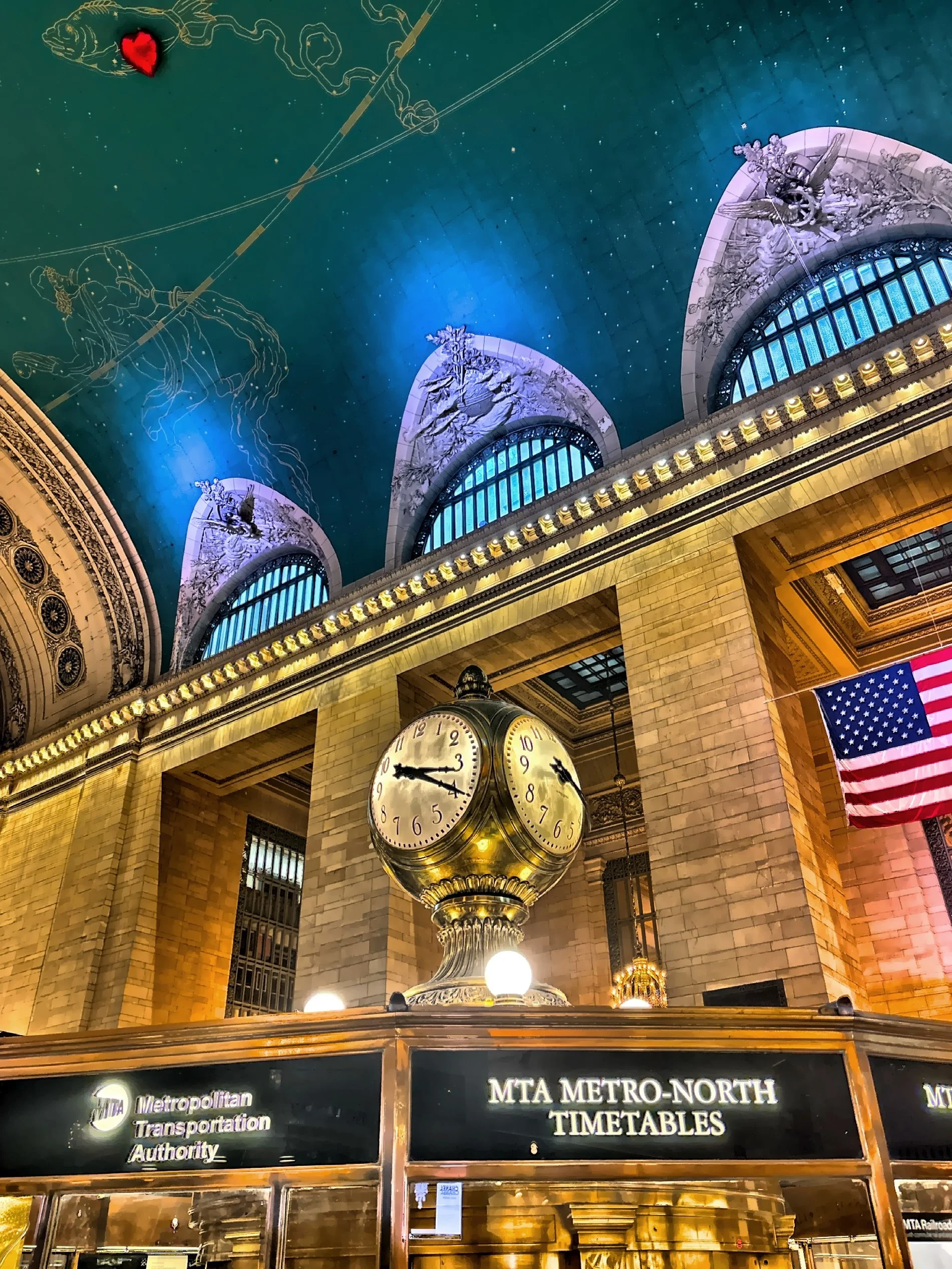  The four-faced brass clock atop the information booth at the center of the concourse. 