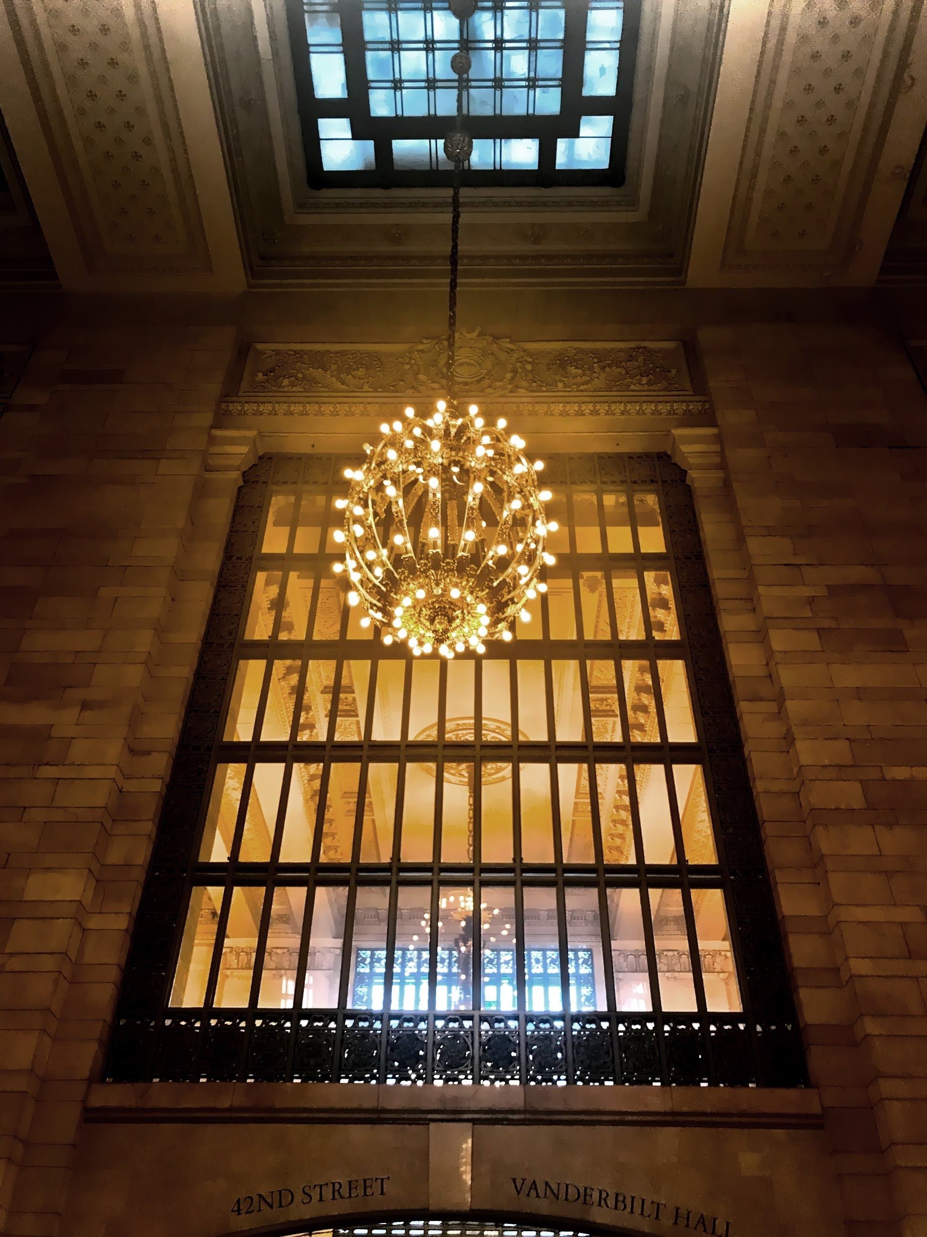  One of the iconic Beaux-Arts chandeliers weighing about 800 pounds each. 