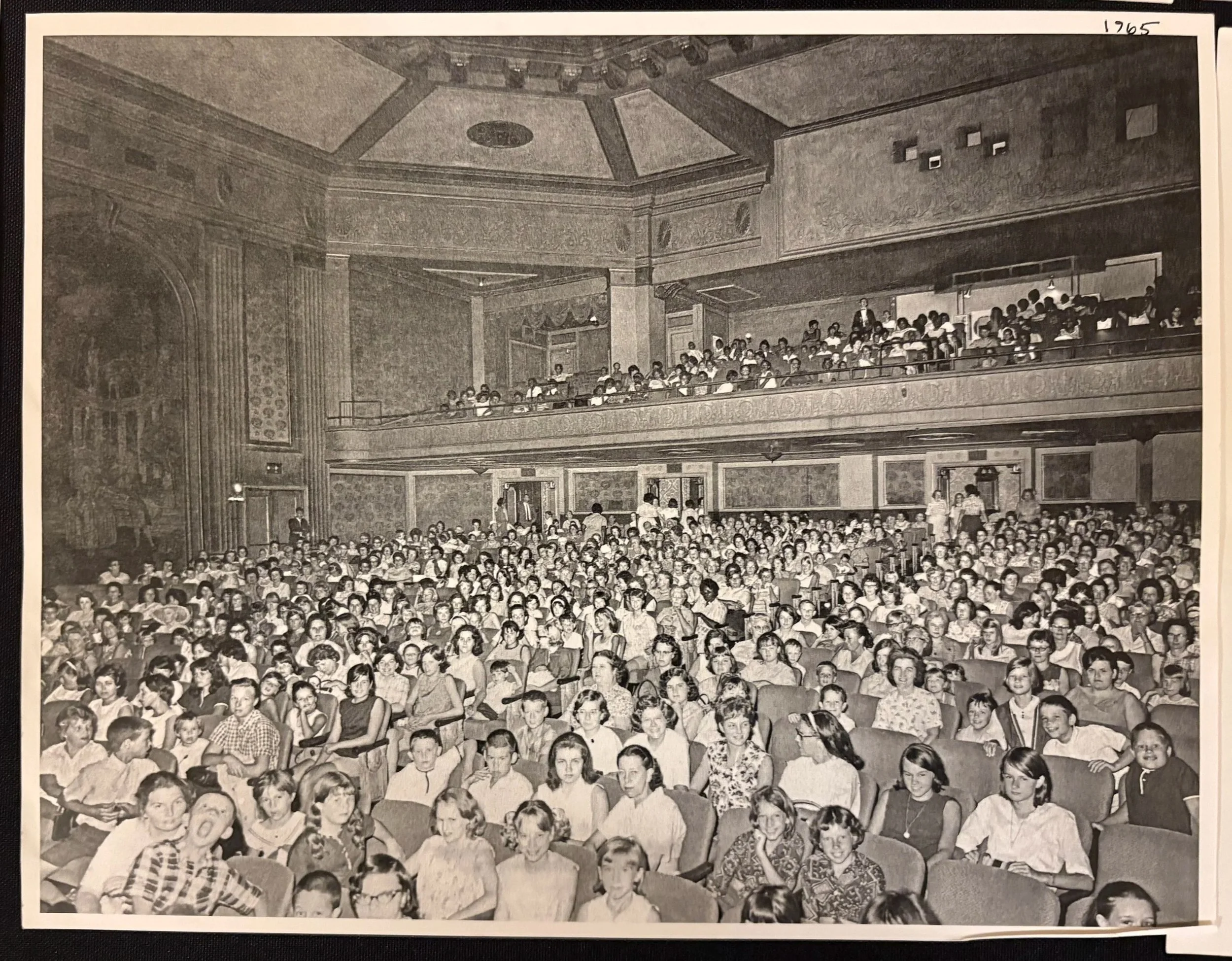 This 1965 photograph reveals a subtle but powerful moment in history, showing one Black woman seated in the lower level of the auditorium. The image quietly reflects the social changes taking place during the Civil Rights era and serves as a reminde
