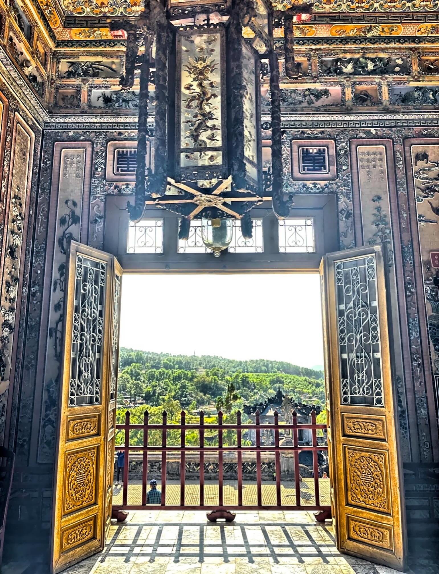 Looking out the doors of Khai Dinh Tomb in Hue, Vietnam. He was one of the most controversial rulers in Vietnam.#huevietnam🇻🇳 #khaidinhtomb Check out my blog: www.GetOutNAbout.com.