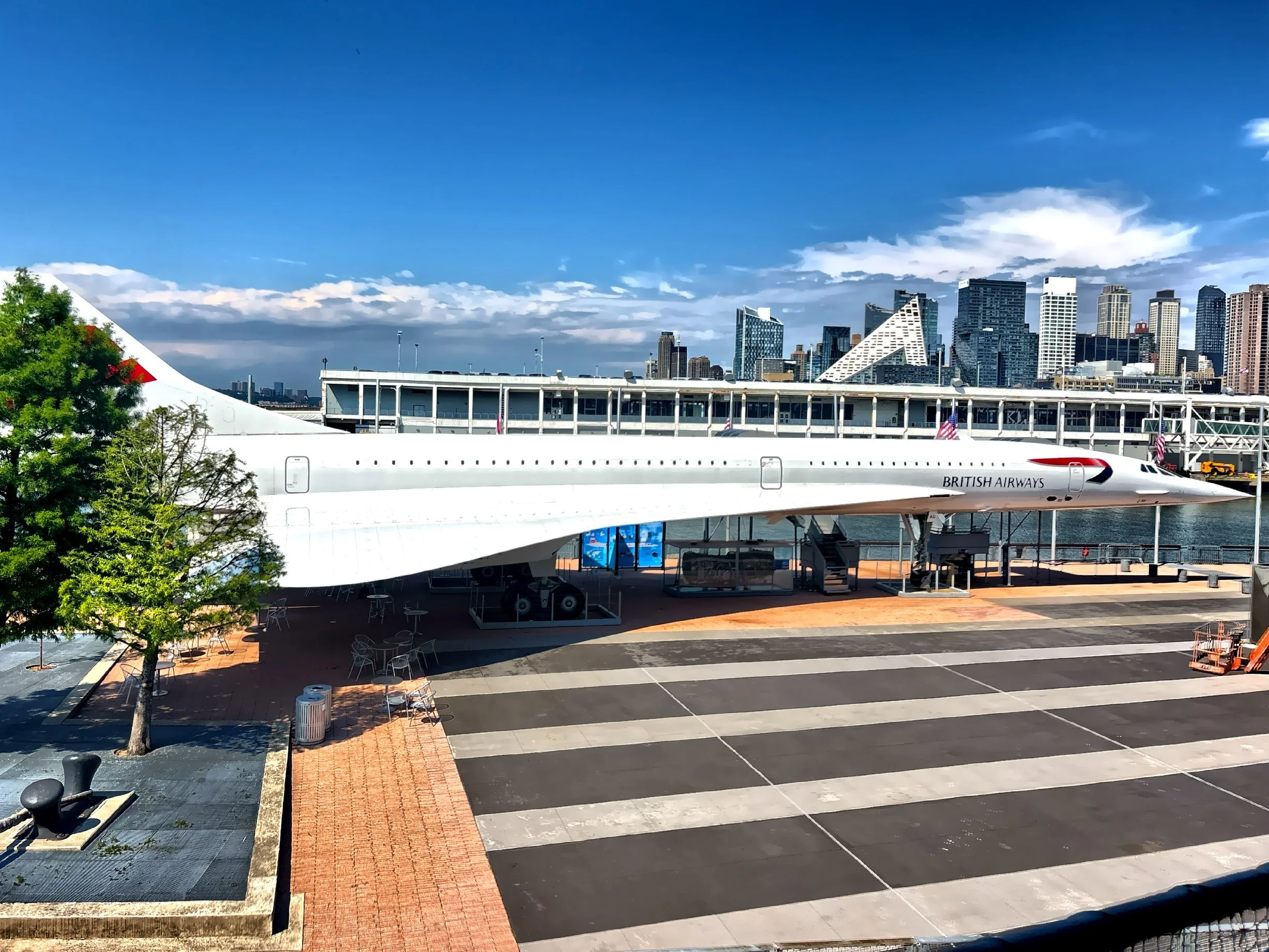  The Concorde is on display on the flight deck, with its sleek, narrow design and distinctive pointed nose on the flight deck. 