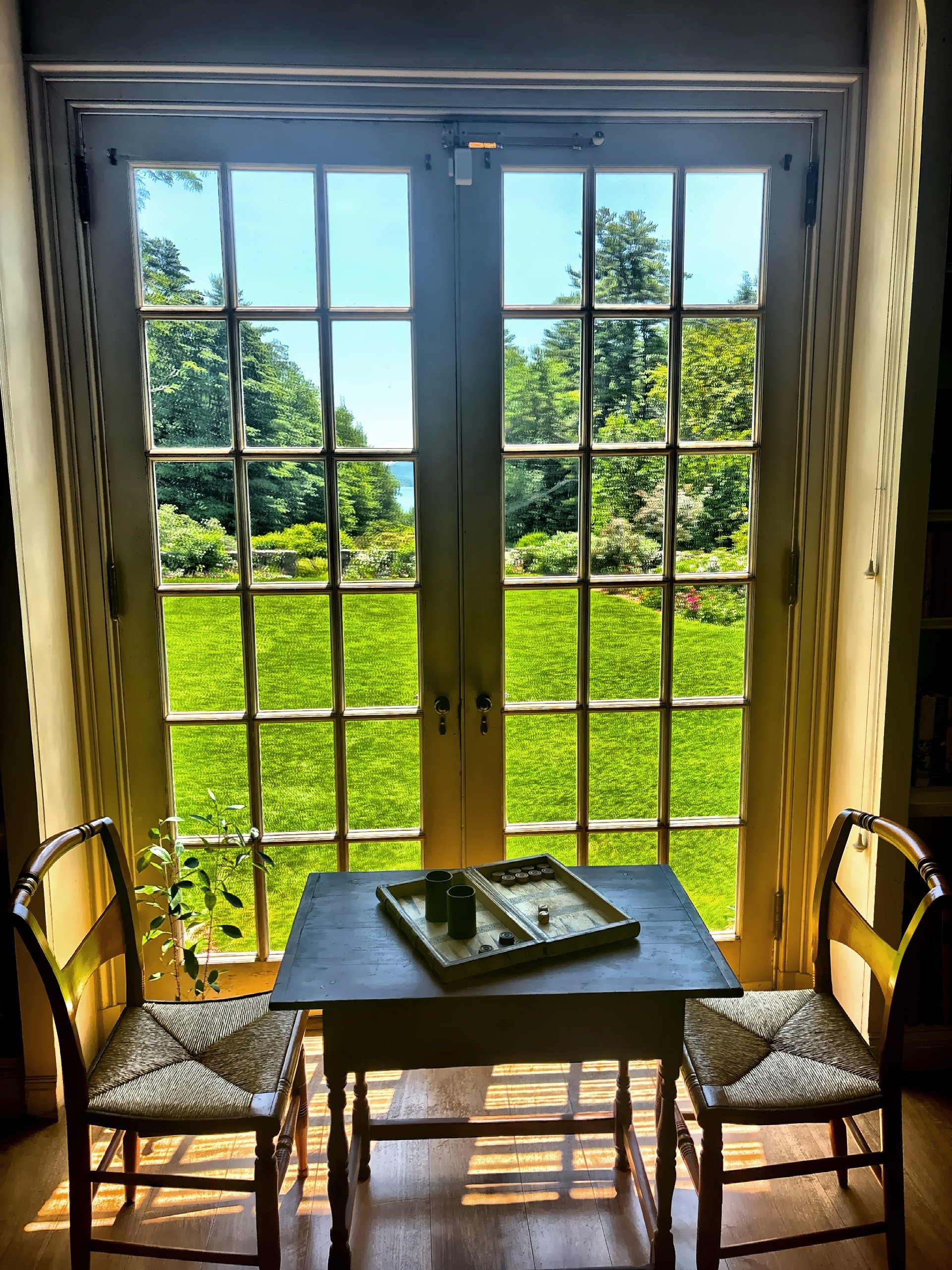  A wooden game table set against the backdrop of the historic grounds. 