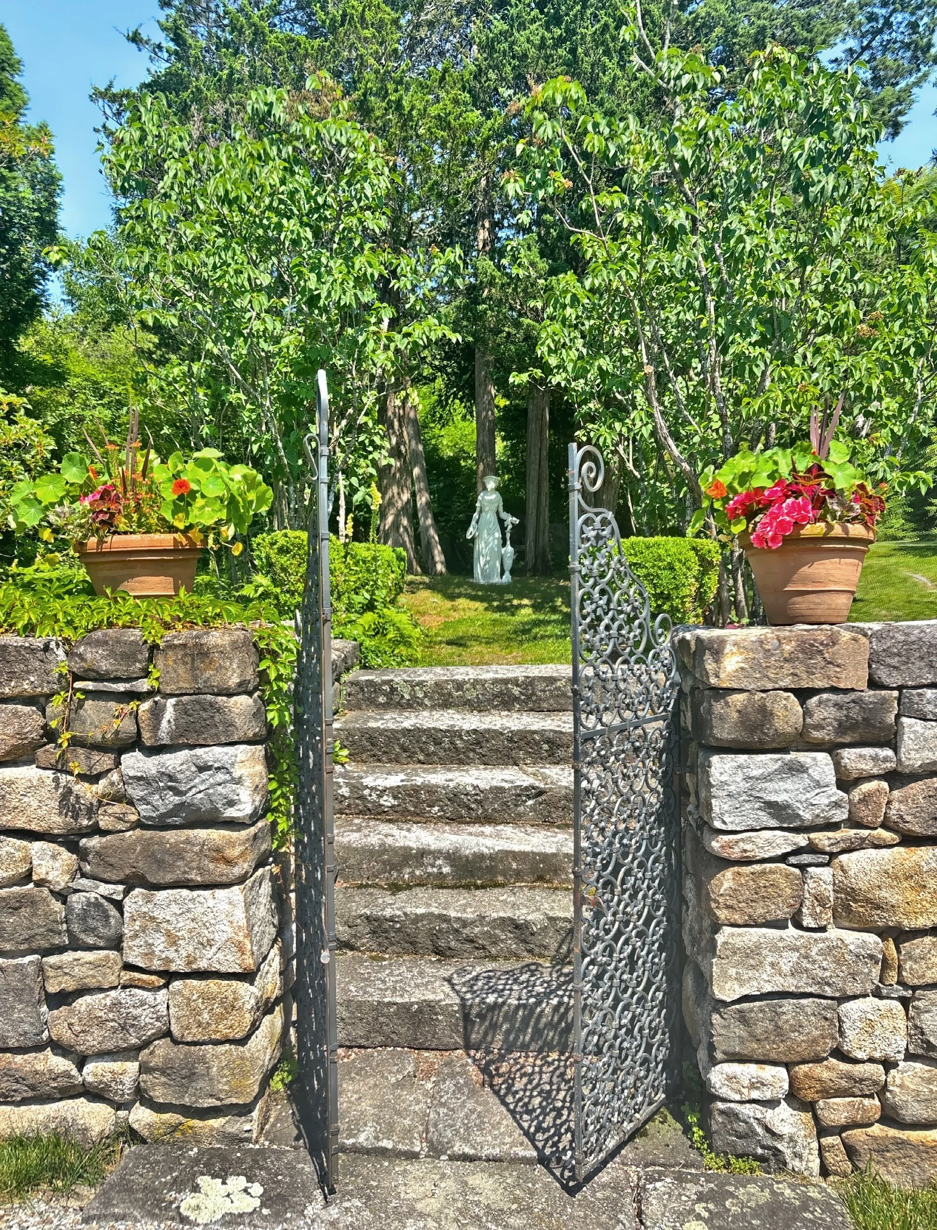  Vintage iron gate and classic garden statue 